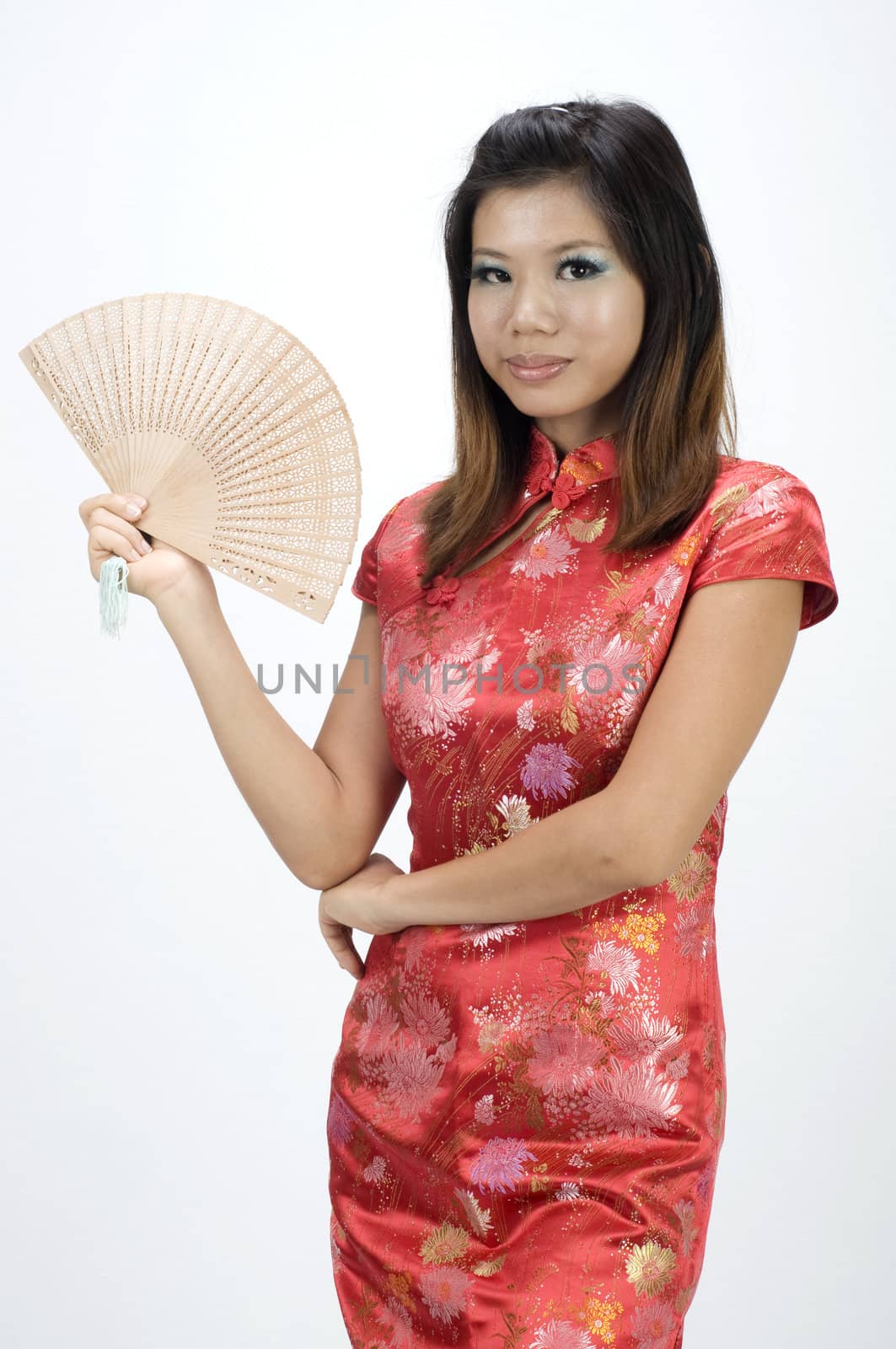 chinese girl in cheongsam and fan