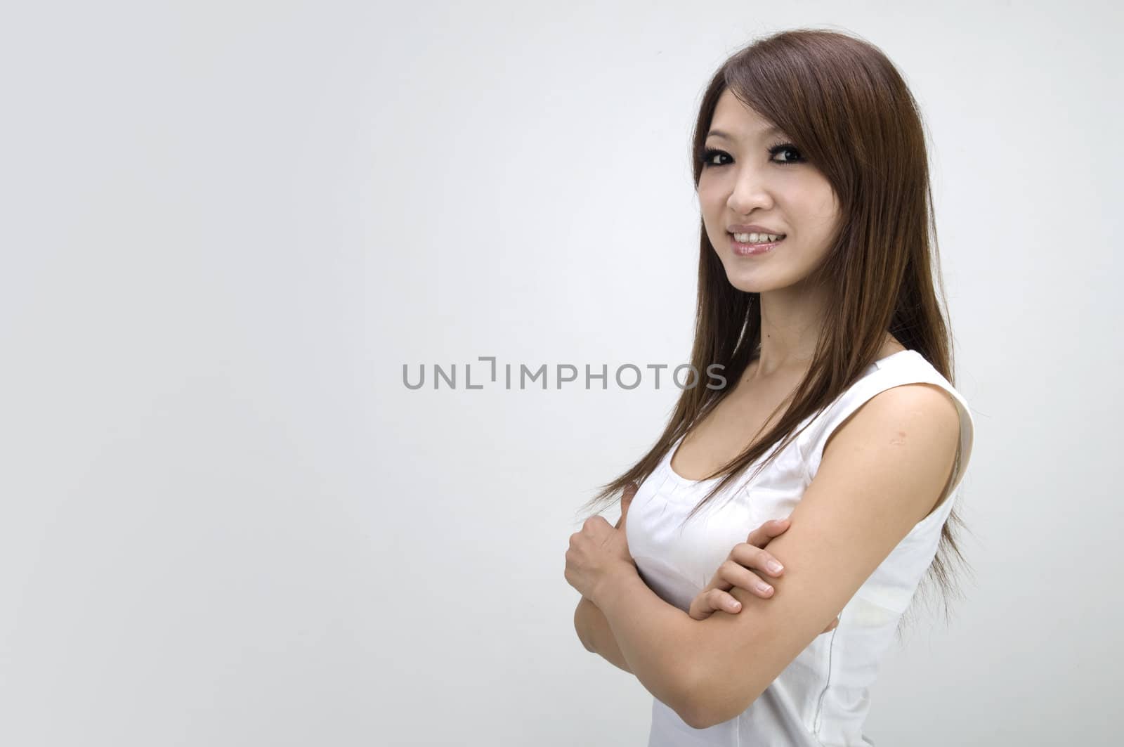 casual looking asian girl crossing arm