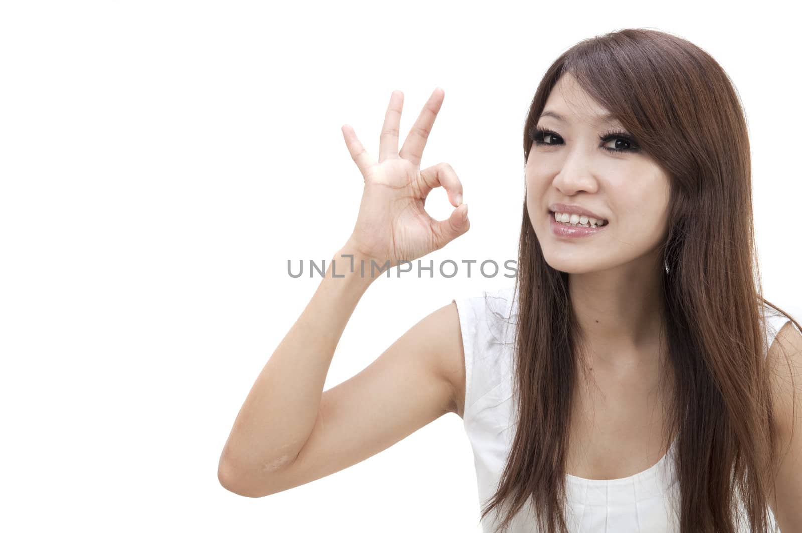pretty young asian girl with ok sign 