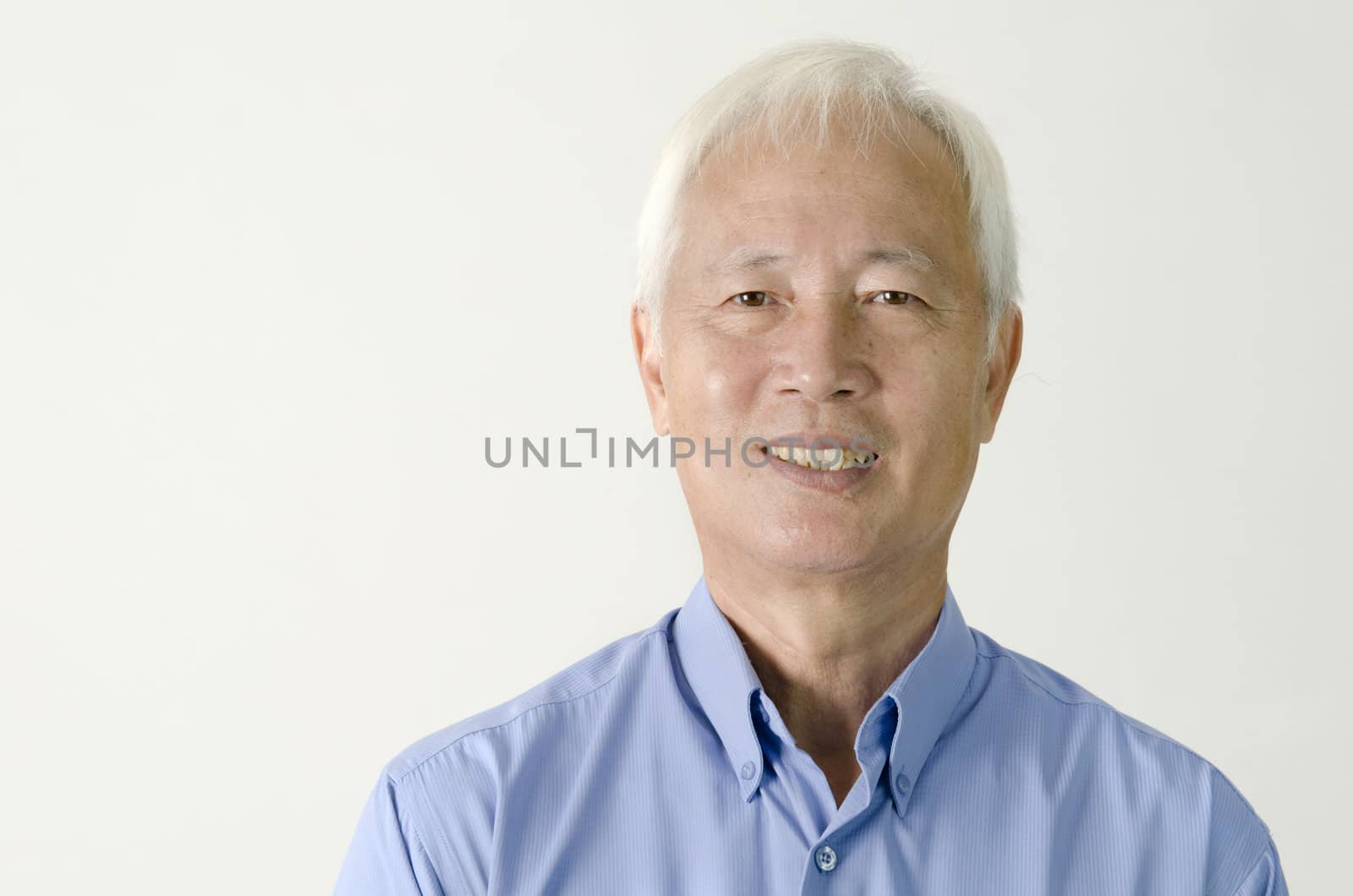 head shot of senior asian business man