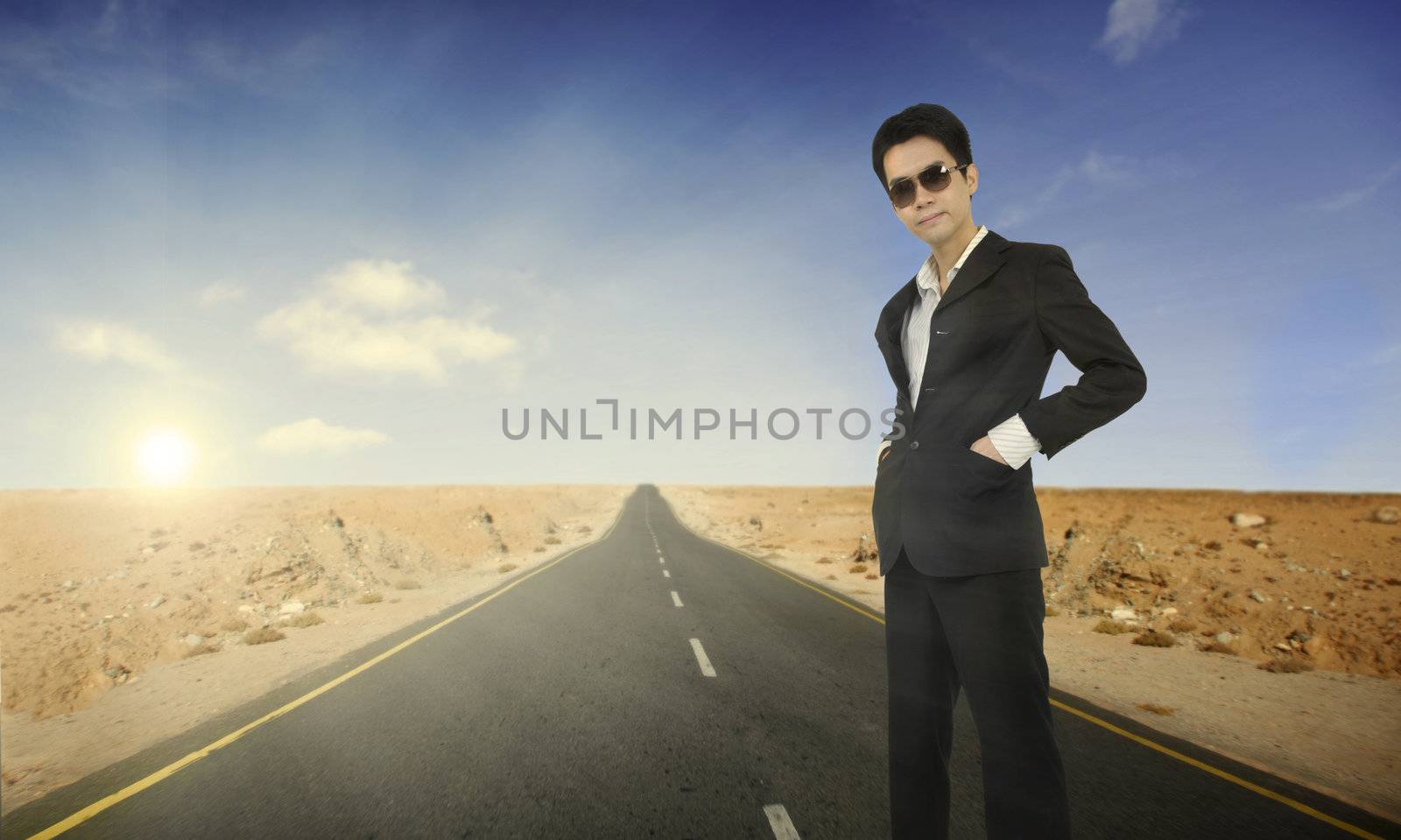 asian man on a lone road