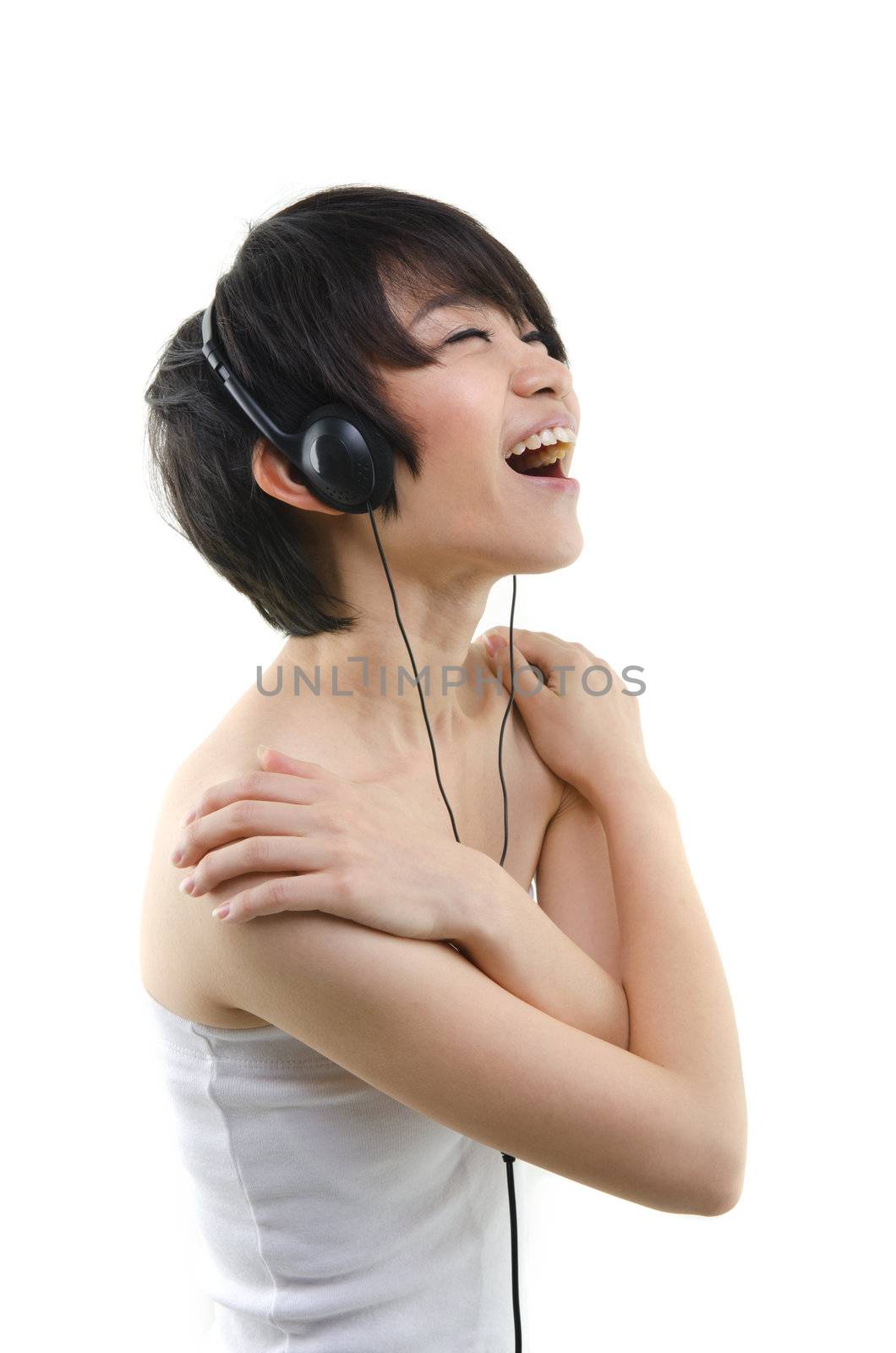 Music. Woman dancing with earbuds / headphones listening to music on mp3 player