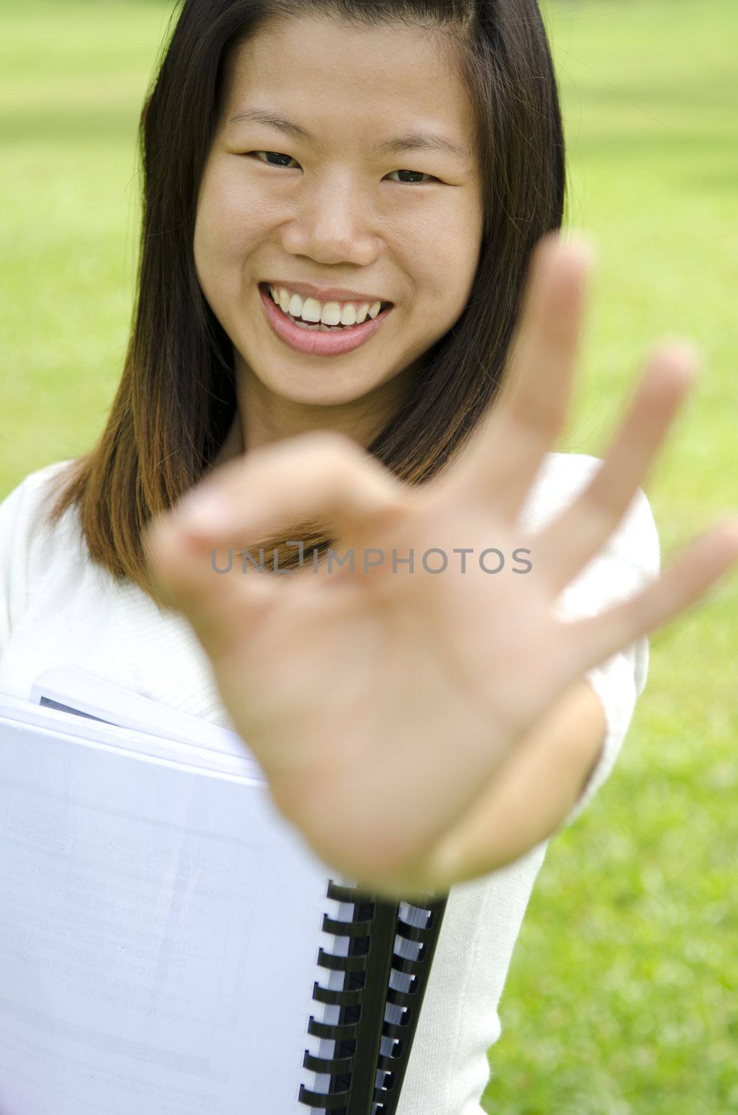 asian girl with green outdoor background