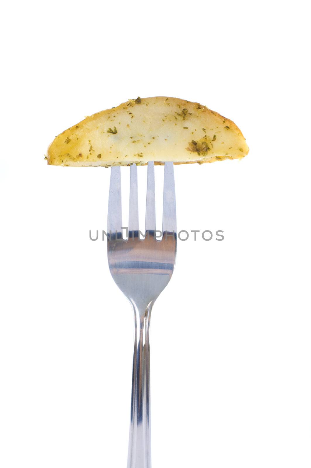baked potatoes,roasted vegetables Close-up .fork with potatoes isolated on a white background
