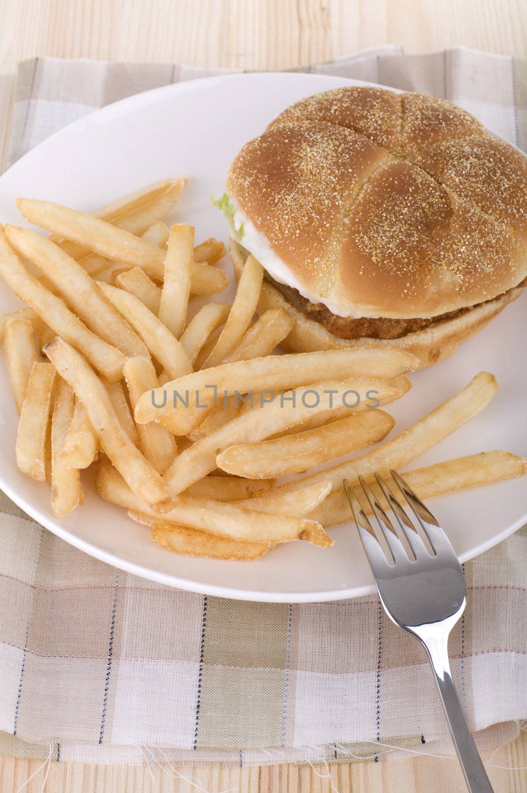 close up shot of burger with chips 