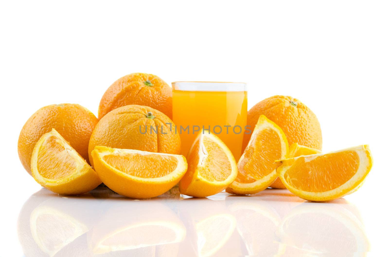 Orange juice and slices of orange isolated on white  by yuliang11
