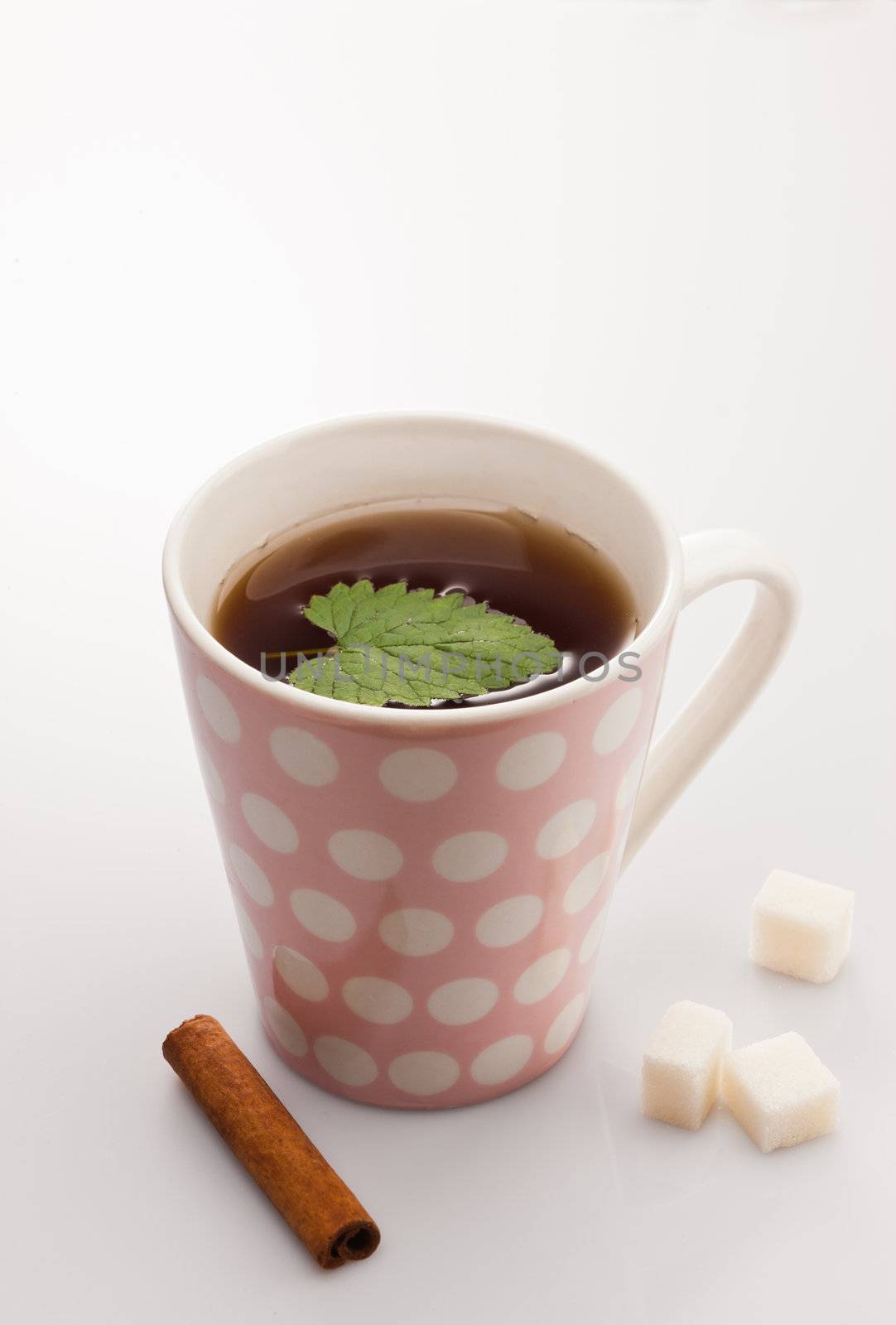 hot tea with leaf of mint and cinnamon stick