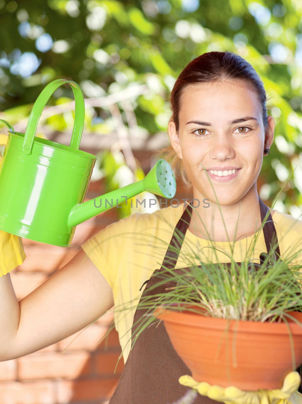 A young woman in a garden jobs on a sunny day