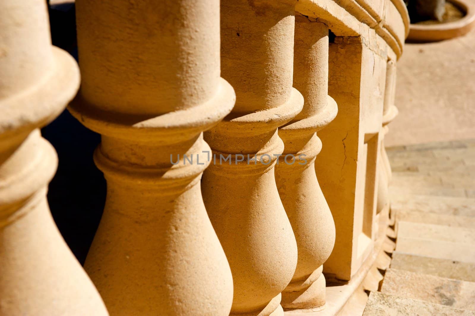 An image of concrete pillars along the edge of a flight of stairs or staircase