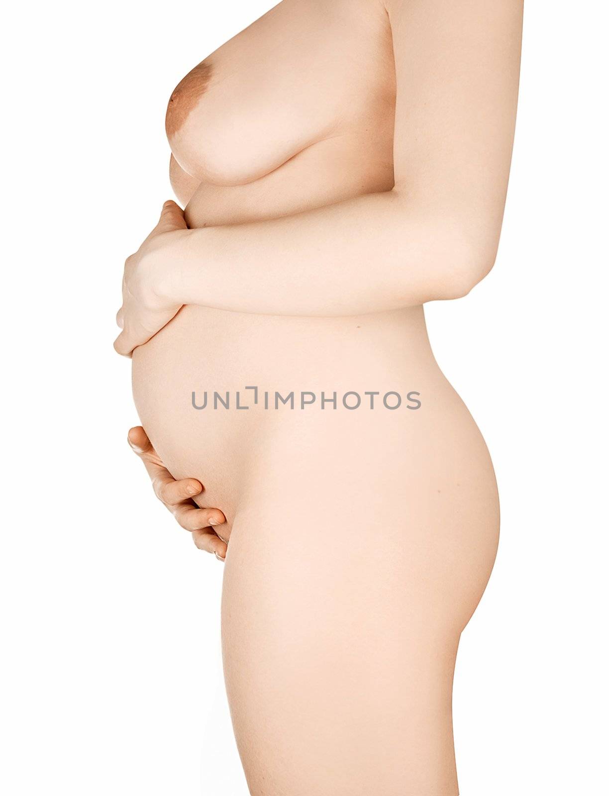 Naked pregnant woman standing over a white background