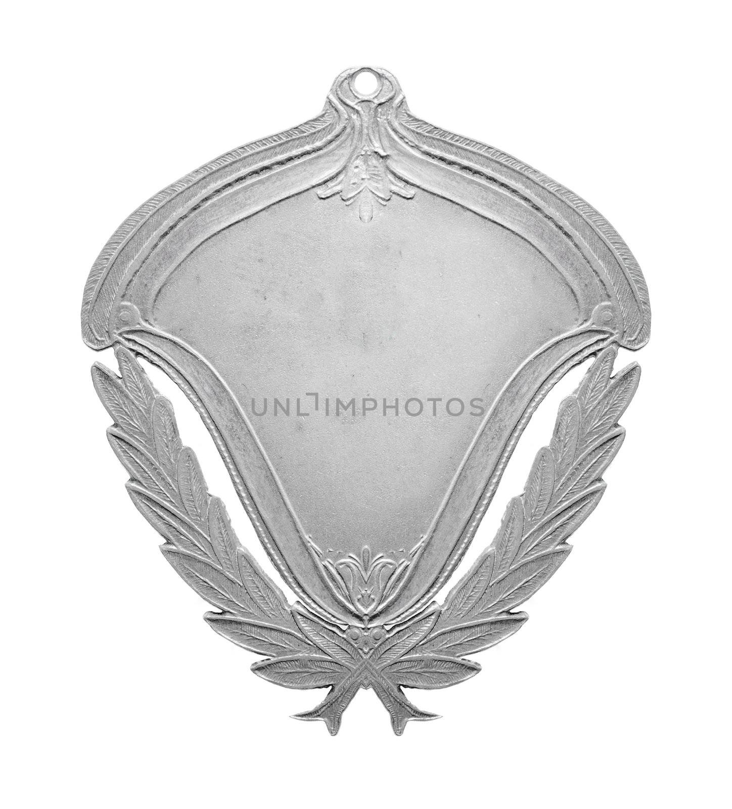 Old silver medal isolated on white.