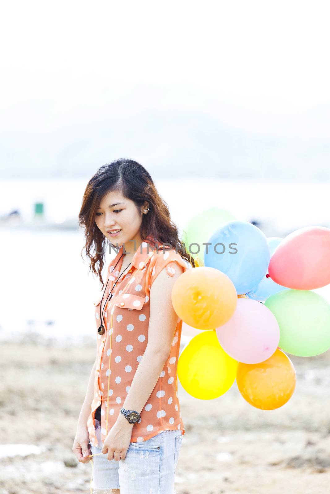 Asian woman with balloon