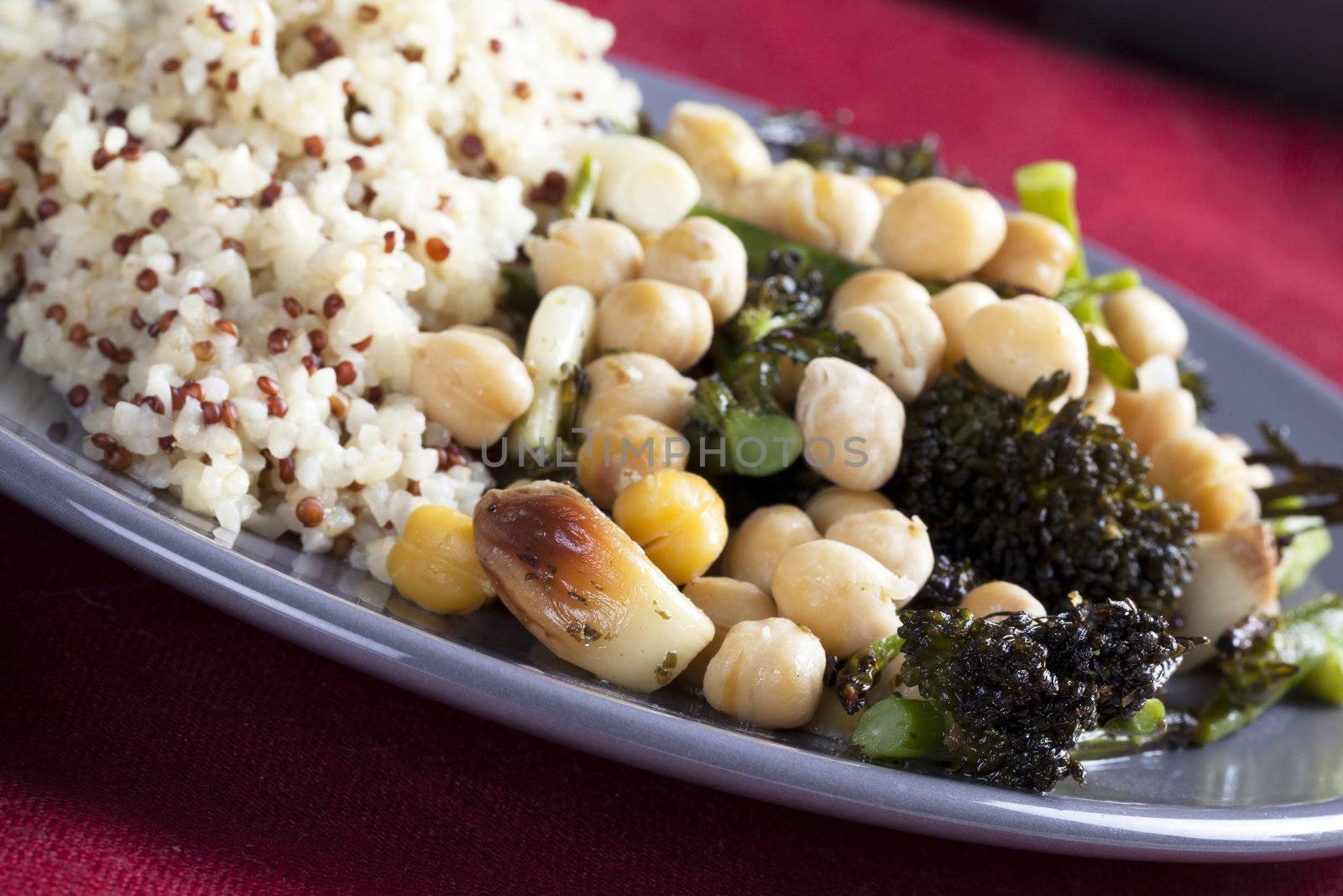 Vegan broccoli and chick pea dinner with roasted garlic and quinoa bulgar mixture