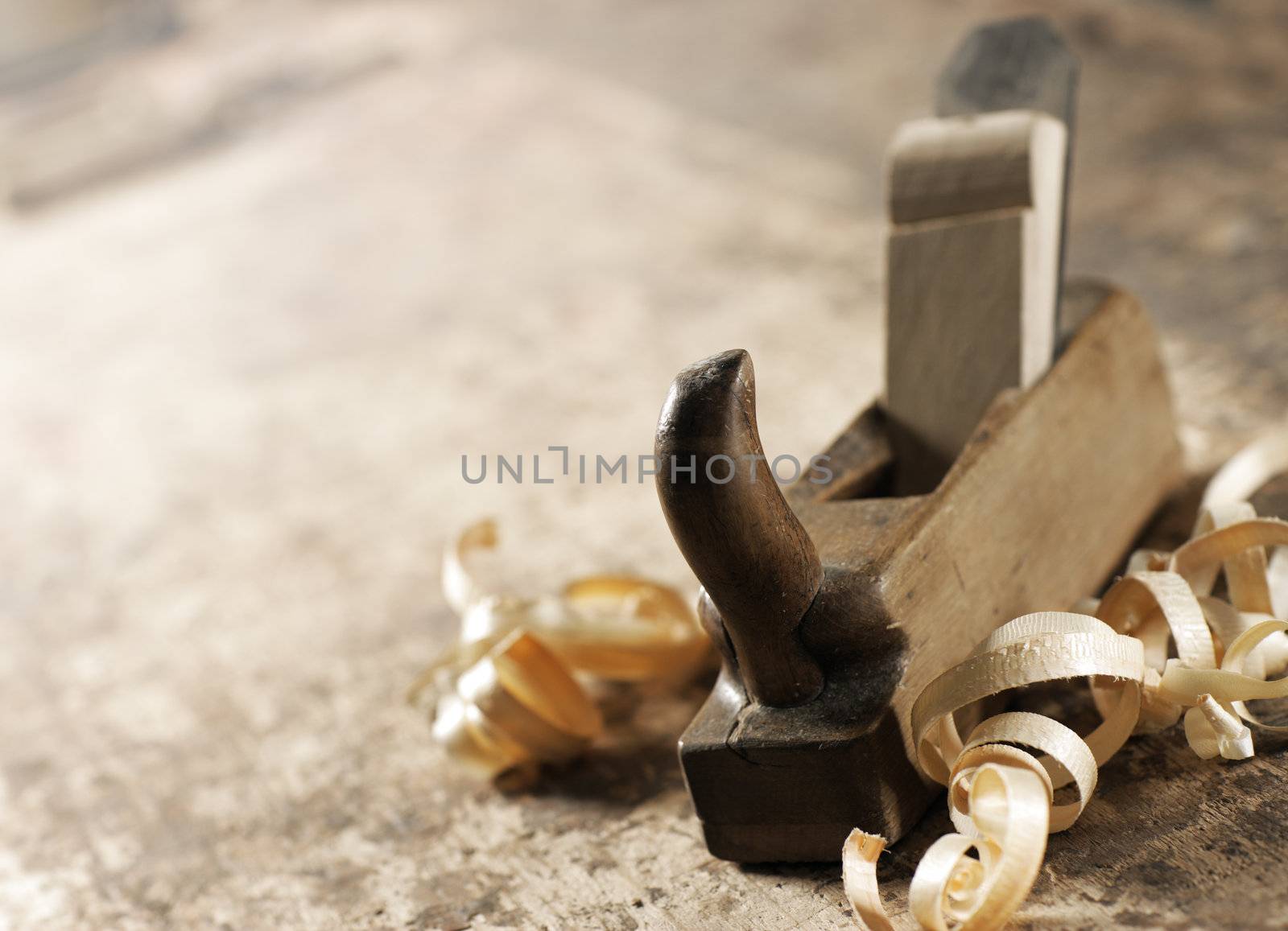 Wood planer and shavings at carpenters workshop