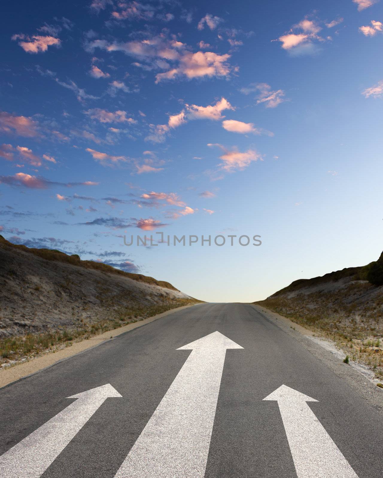 Image of road with white arrow directing forward
