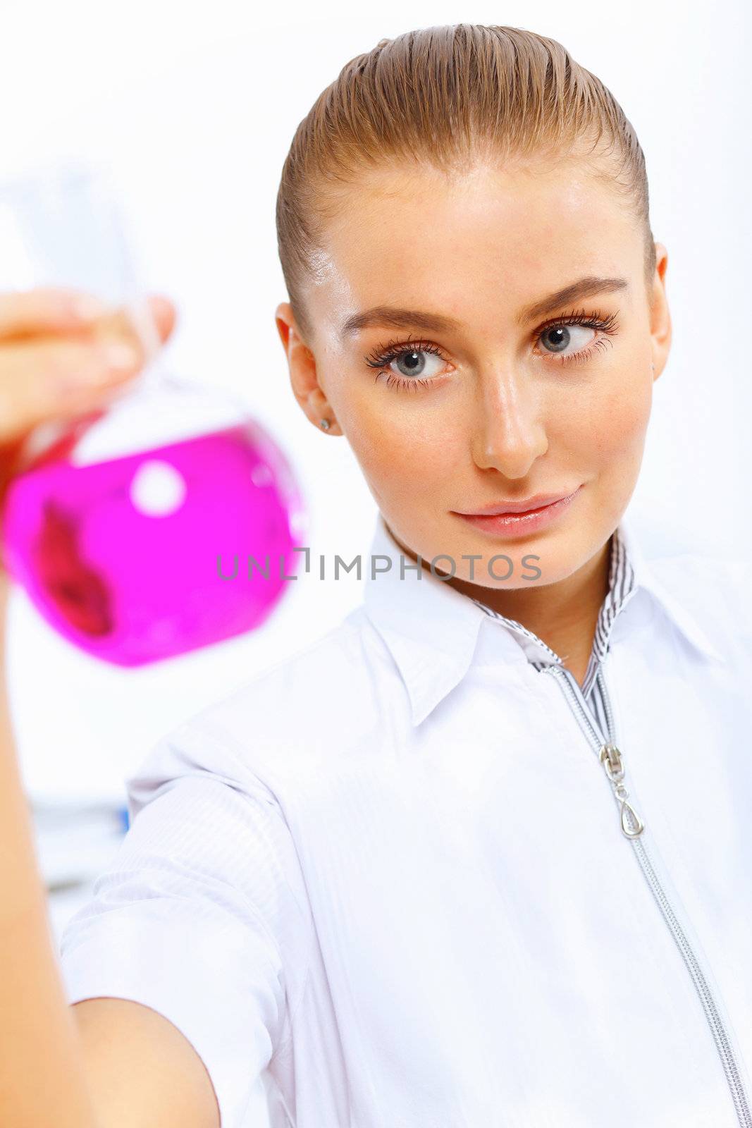 Young female scientist working in laboratory by sergey_nivens
