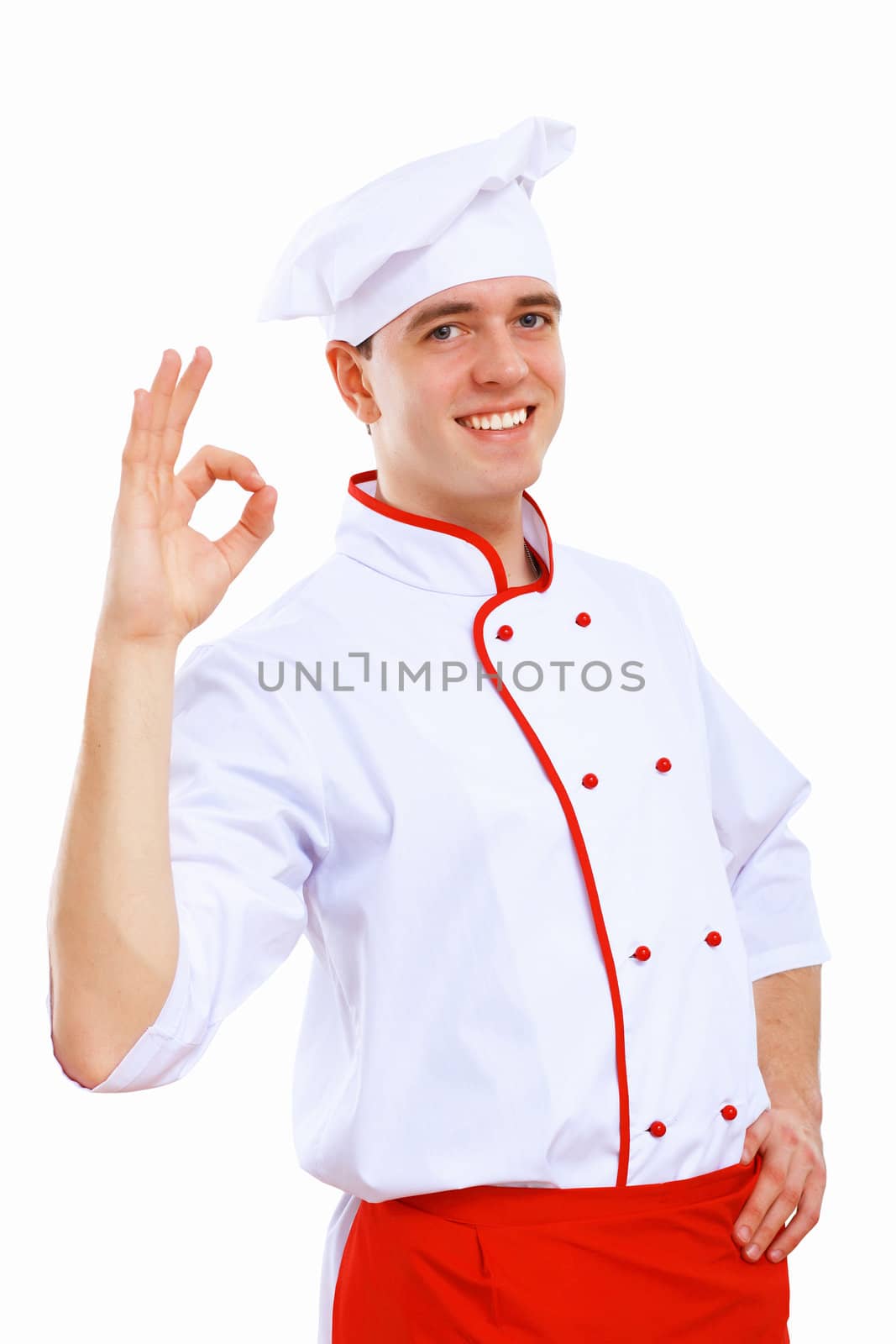 Young cook preparing food wearing a red apron