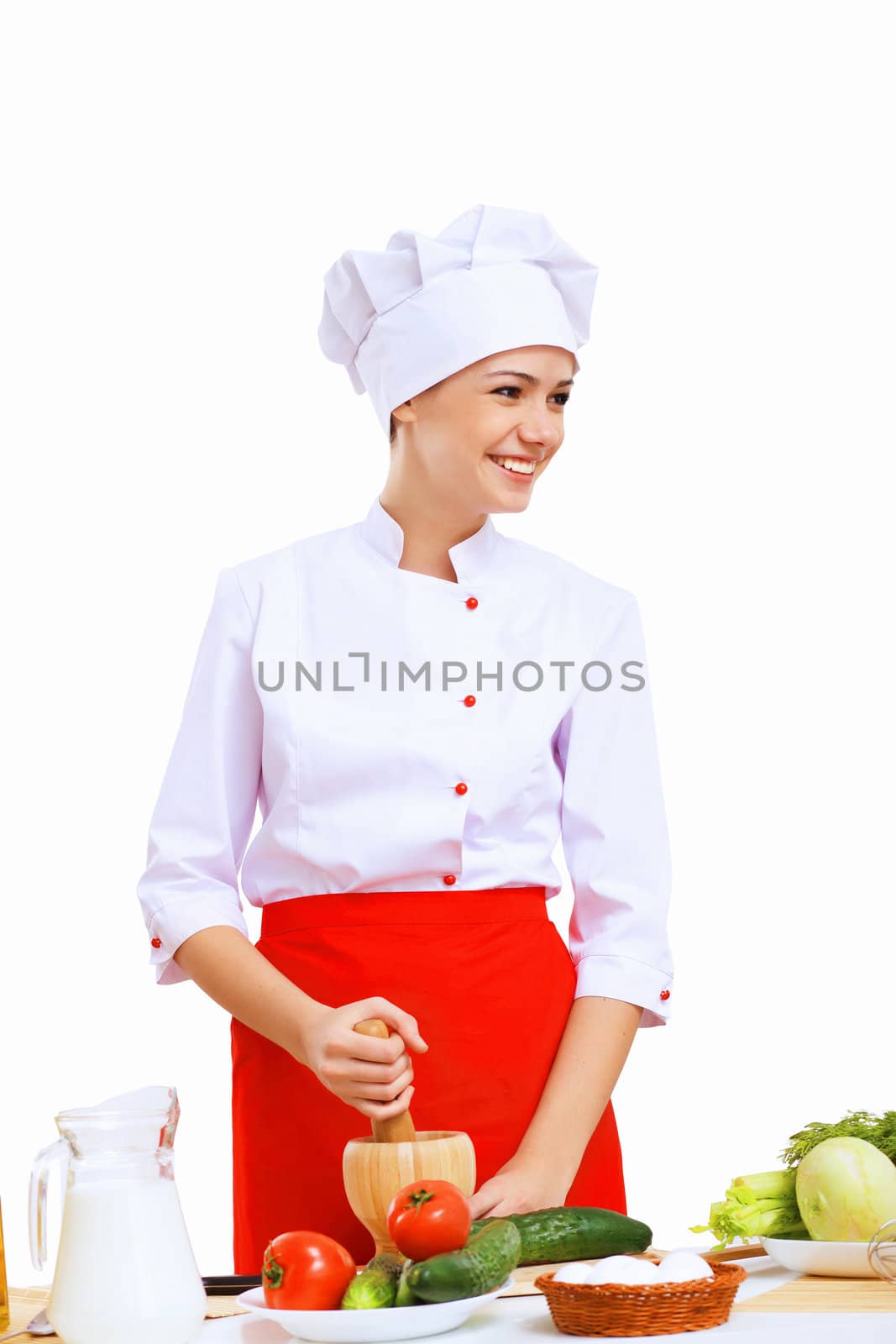 Young cook preparing food wearing a red apron