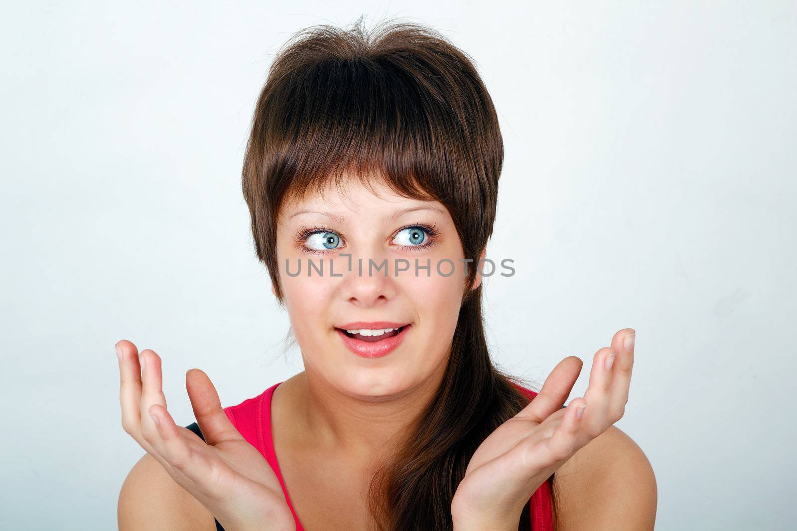 admiration for the young attractive girl teenager. Portrait on a light background