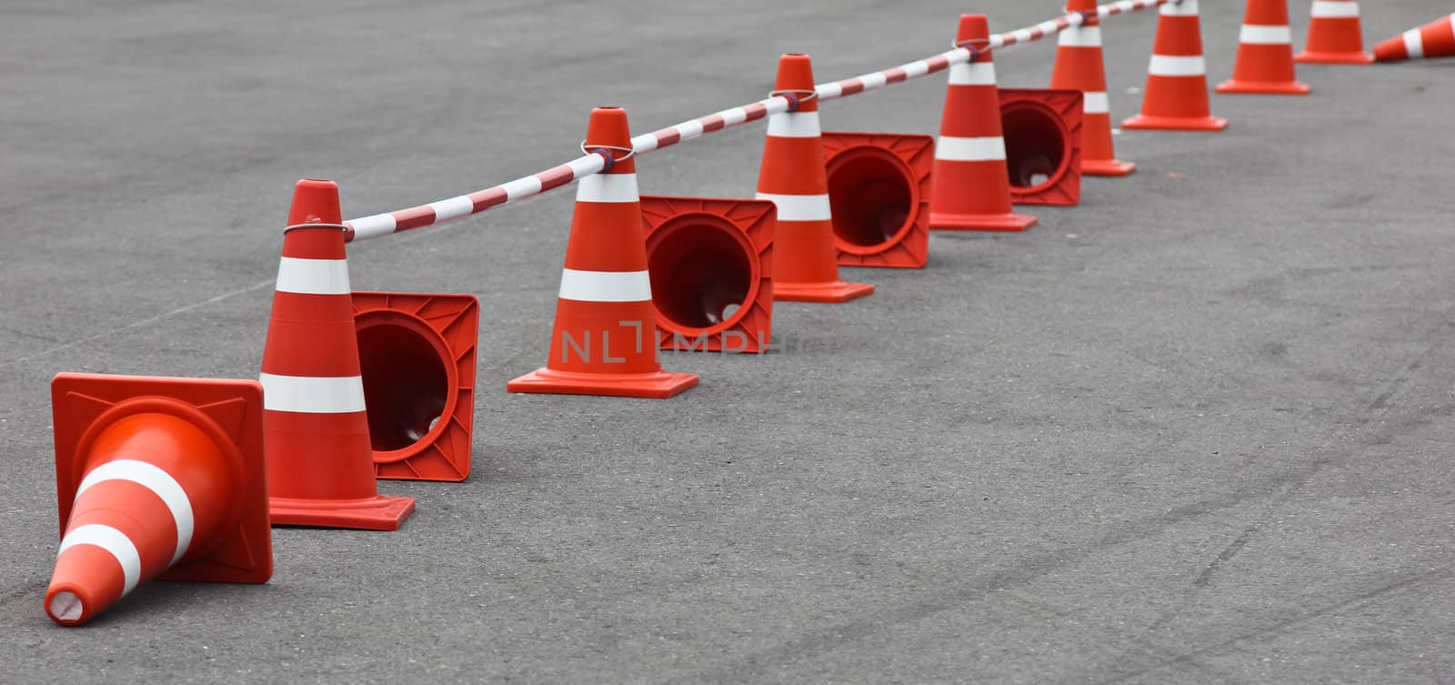 Background with traffic cone on road track