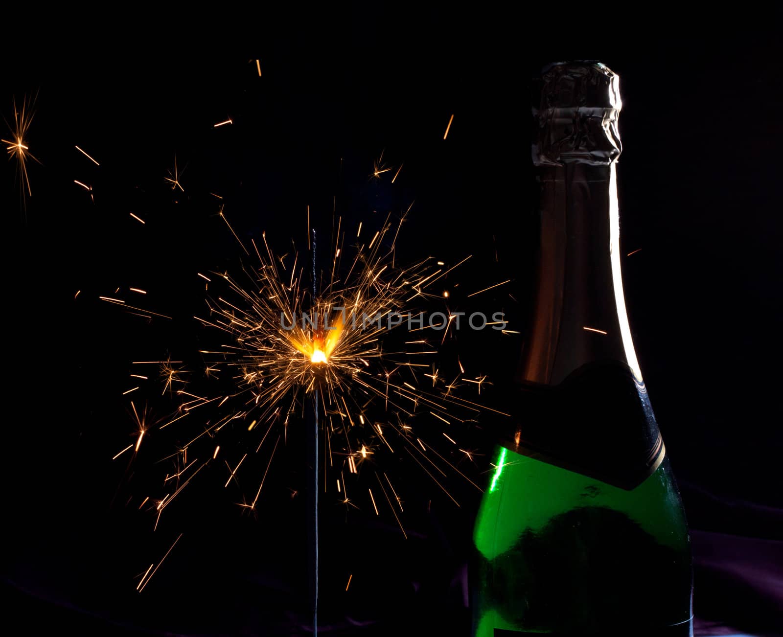 Champagne bottle and sparklers, new year