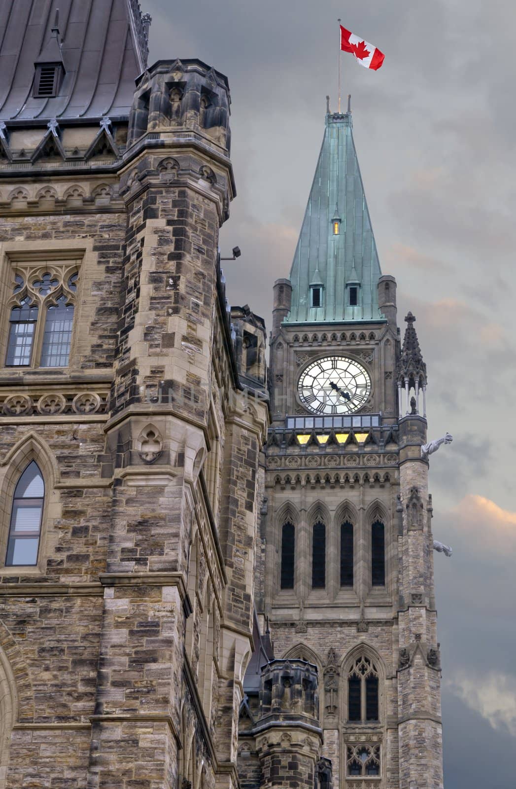 The canadian Parliament on a summer afternoon with angry clouds.