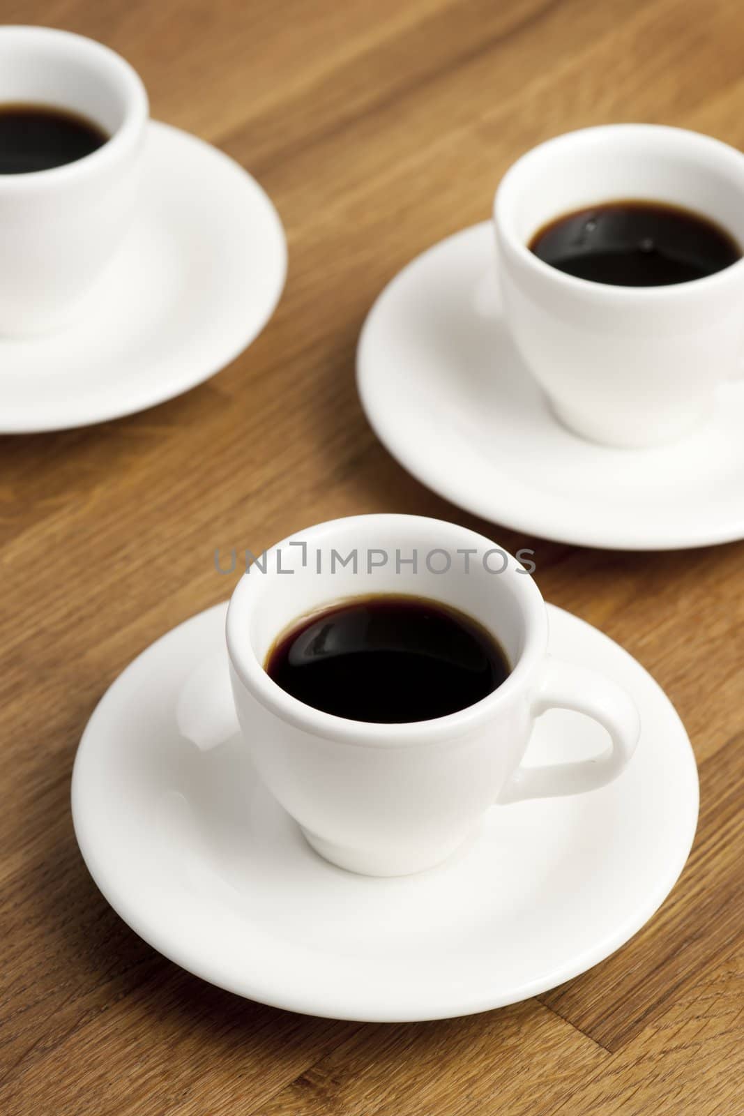 Three coffee cups on the table.