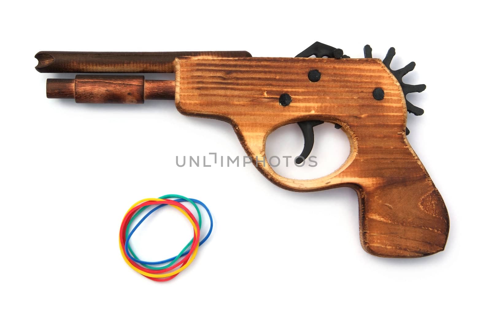 Toy wooden gun and elastic band , on a white background  by opasstudio