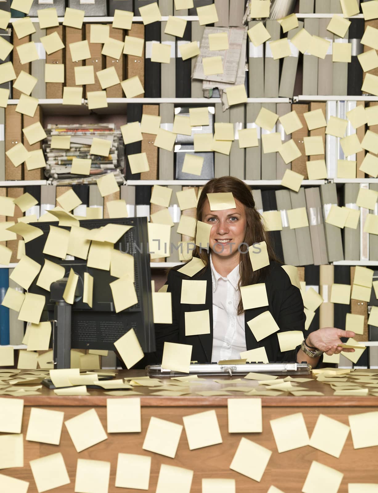 Businesswoman overloaded with reminding notes