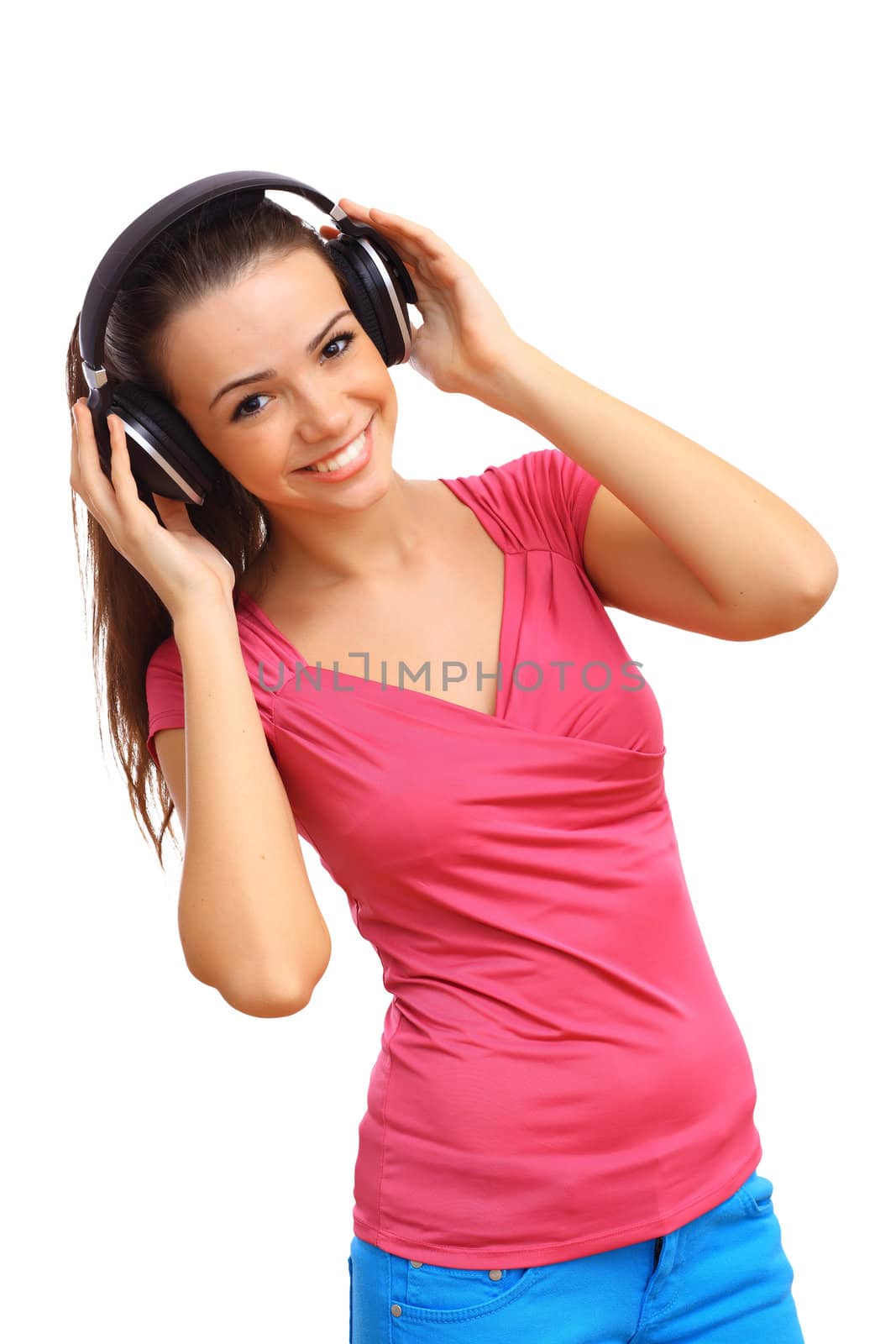 Happy smiling girl dancing and listening to music