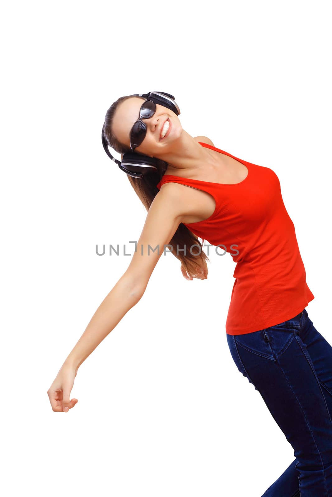 Happy smiling girl dancing and listening to music