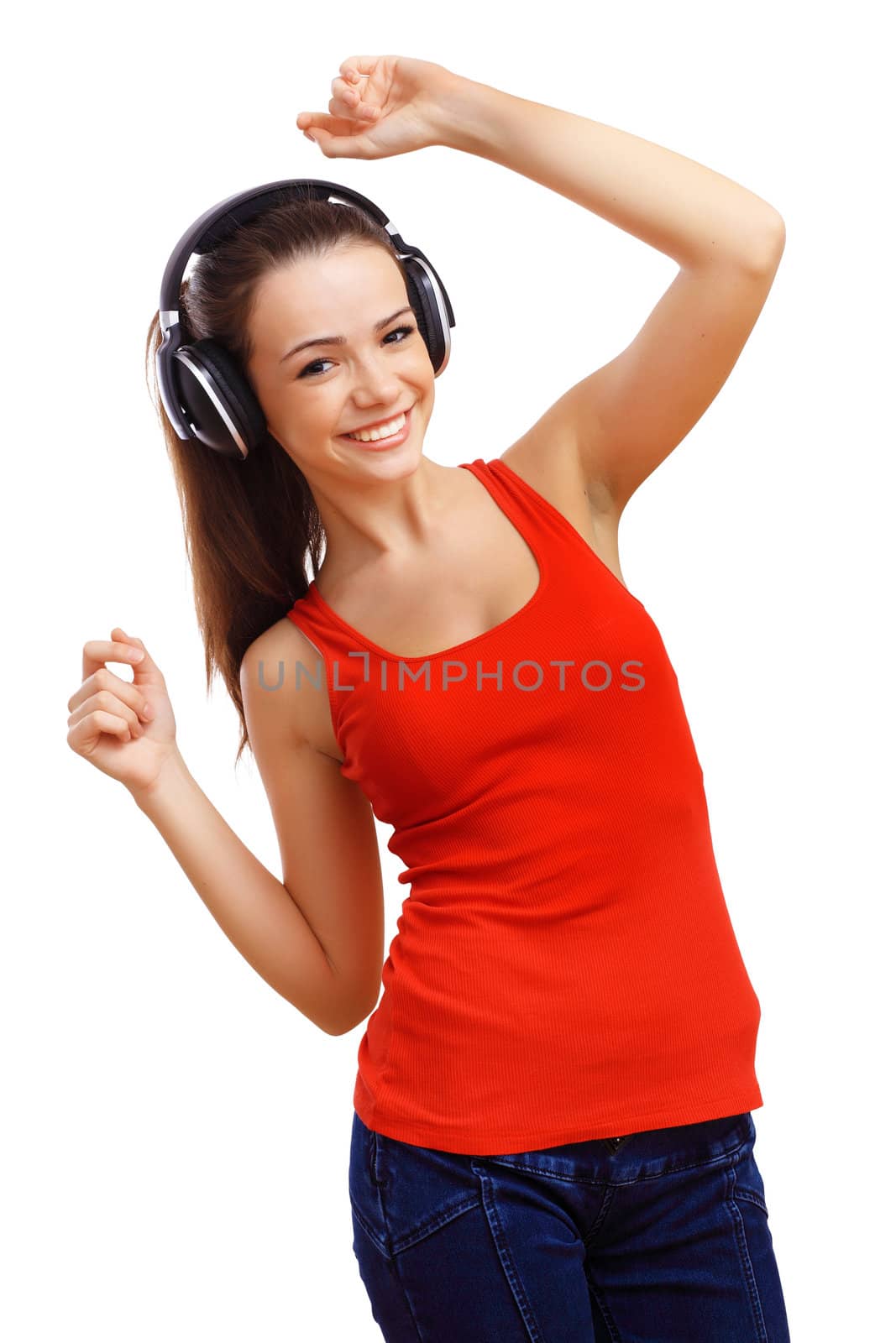 Happy smiling girl dancing and listening to music