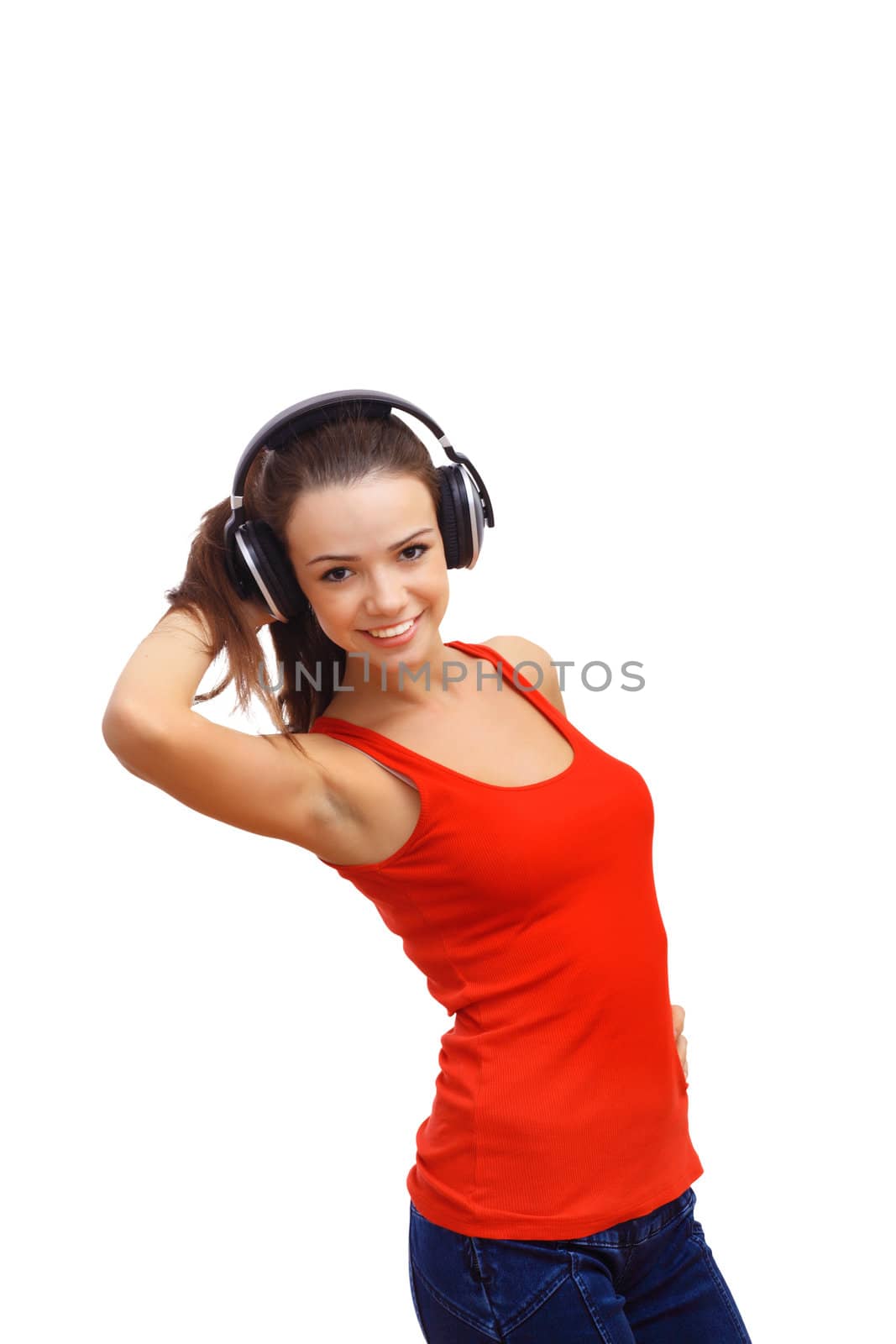 Happy smiling girl dancing and listening to music