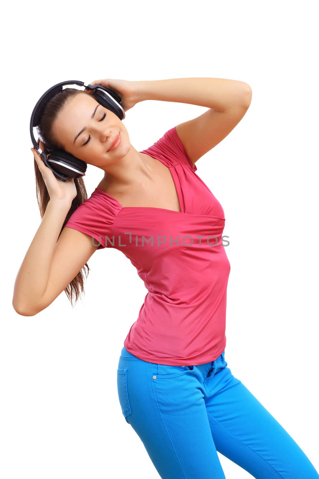 Happy smiling girl dancing and listening to music