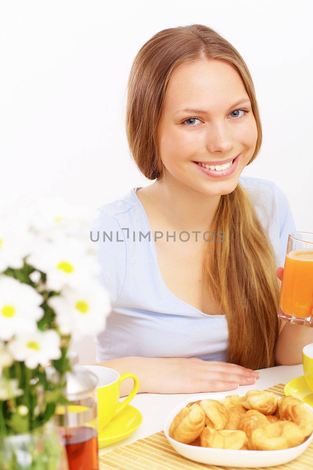 Beautiful young woman drinking tea by sergey_nivens