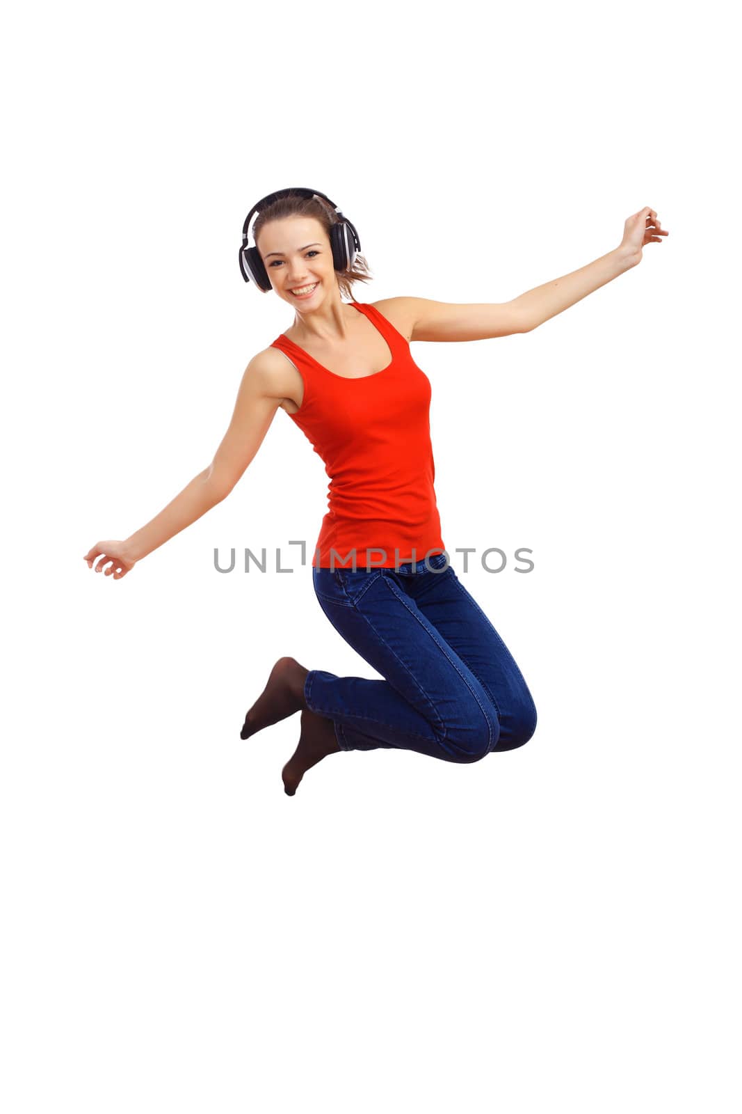 Happy smiling girl dancing and listening to music