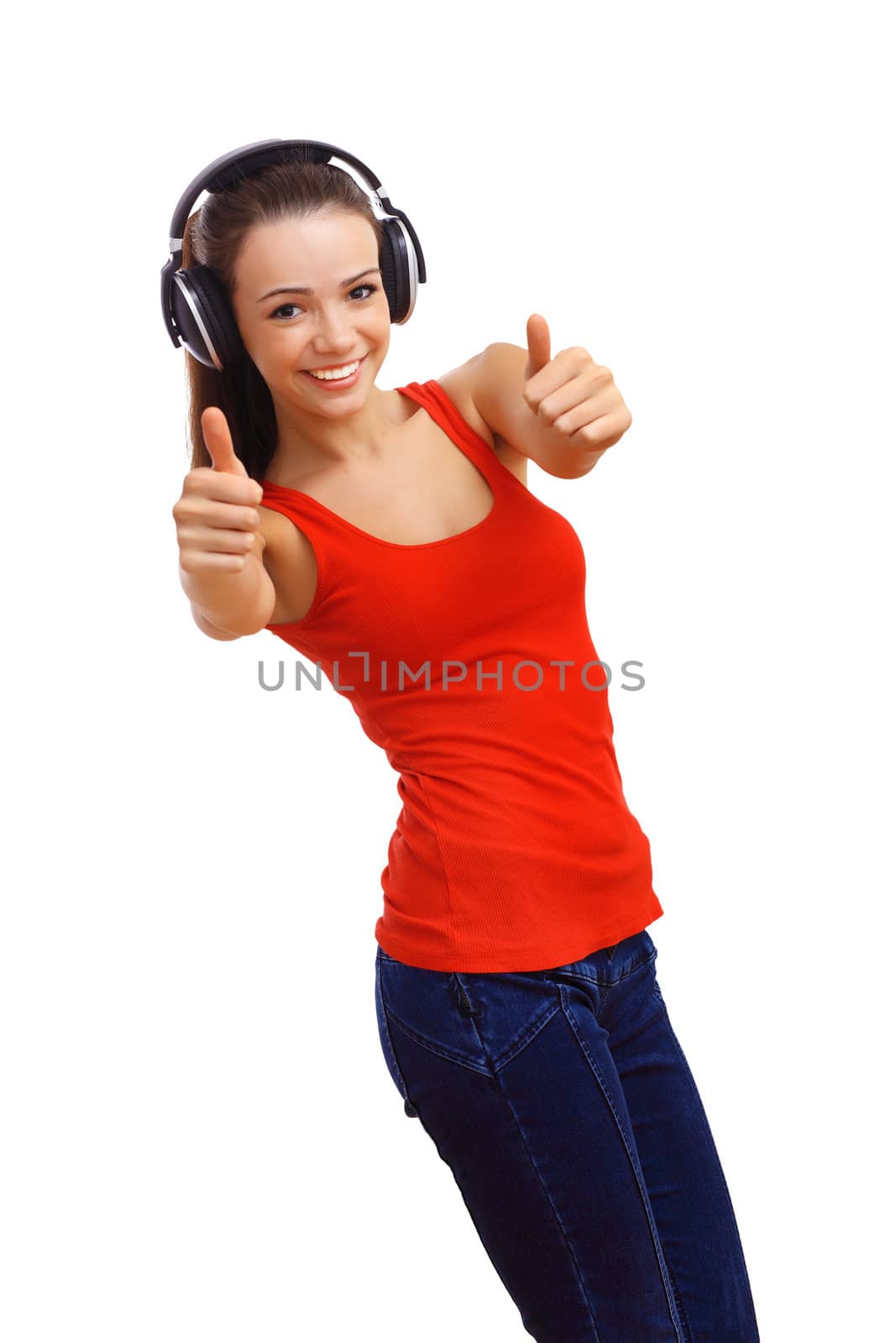 Happy smiling girl dancing and listening to music