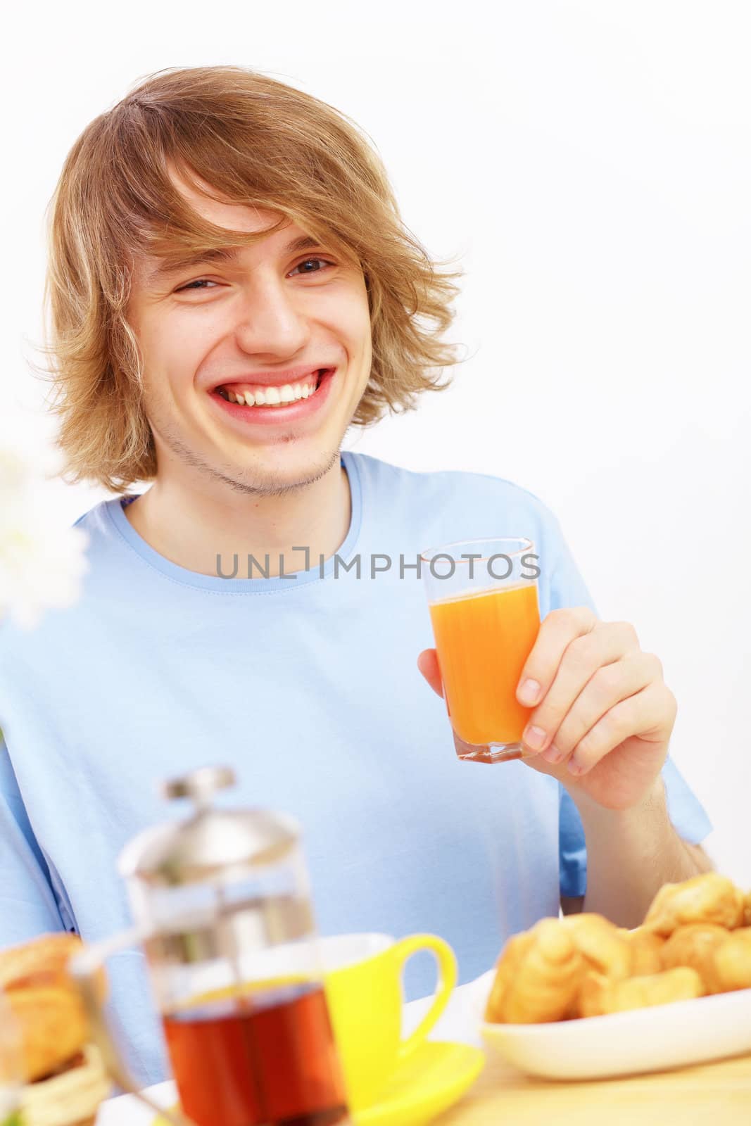 Young man drinking juice by sergey_nivens
