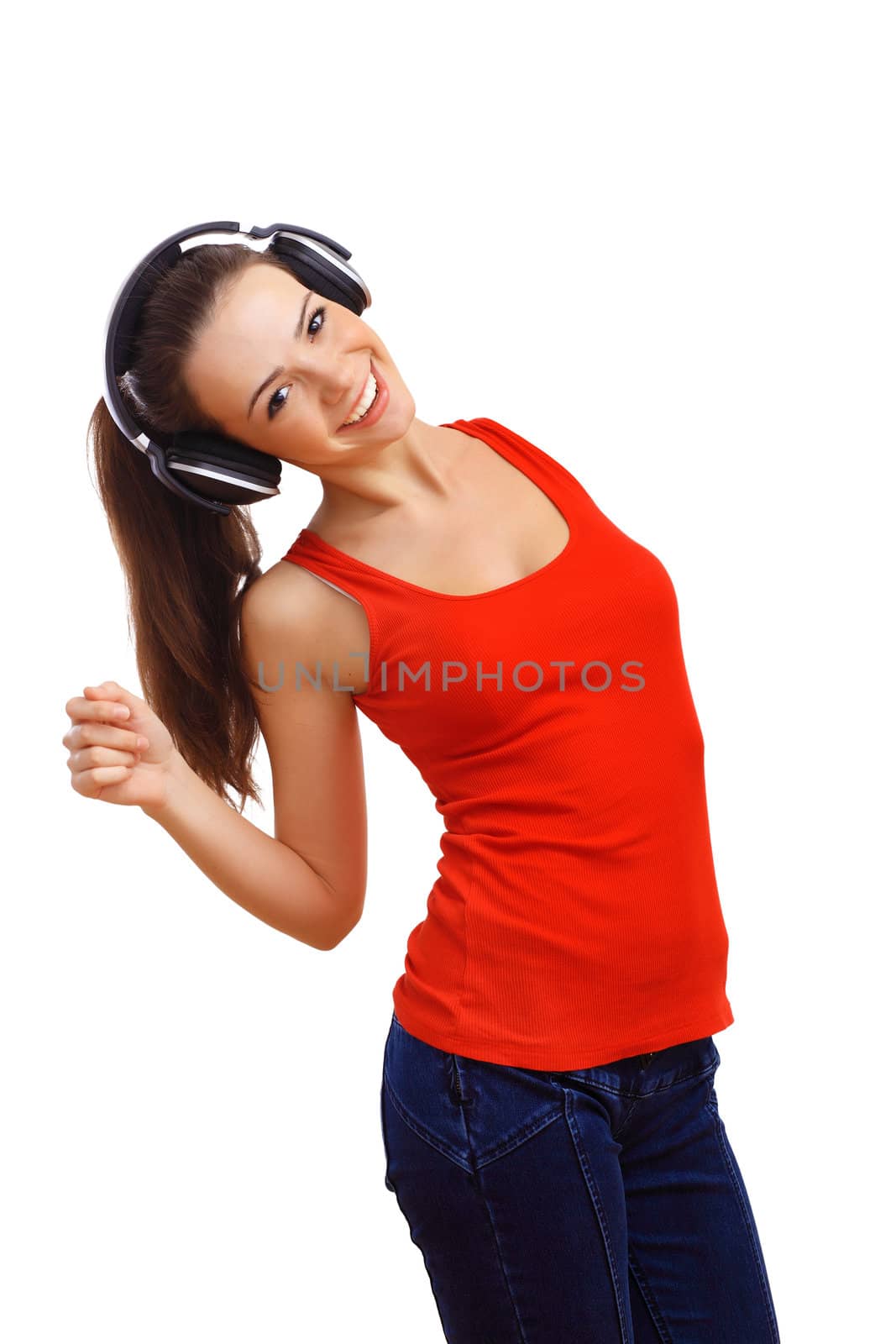 Happy smiling girl dancing and listening to music