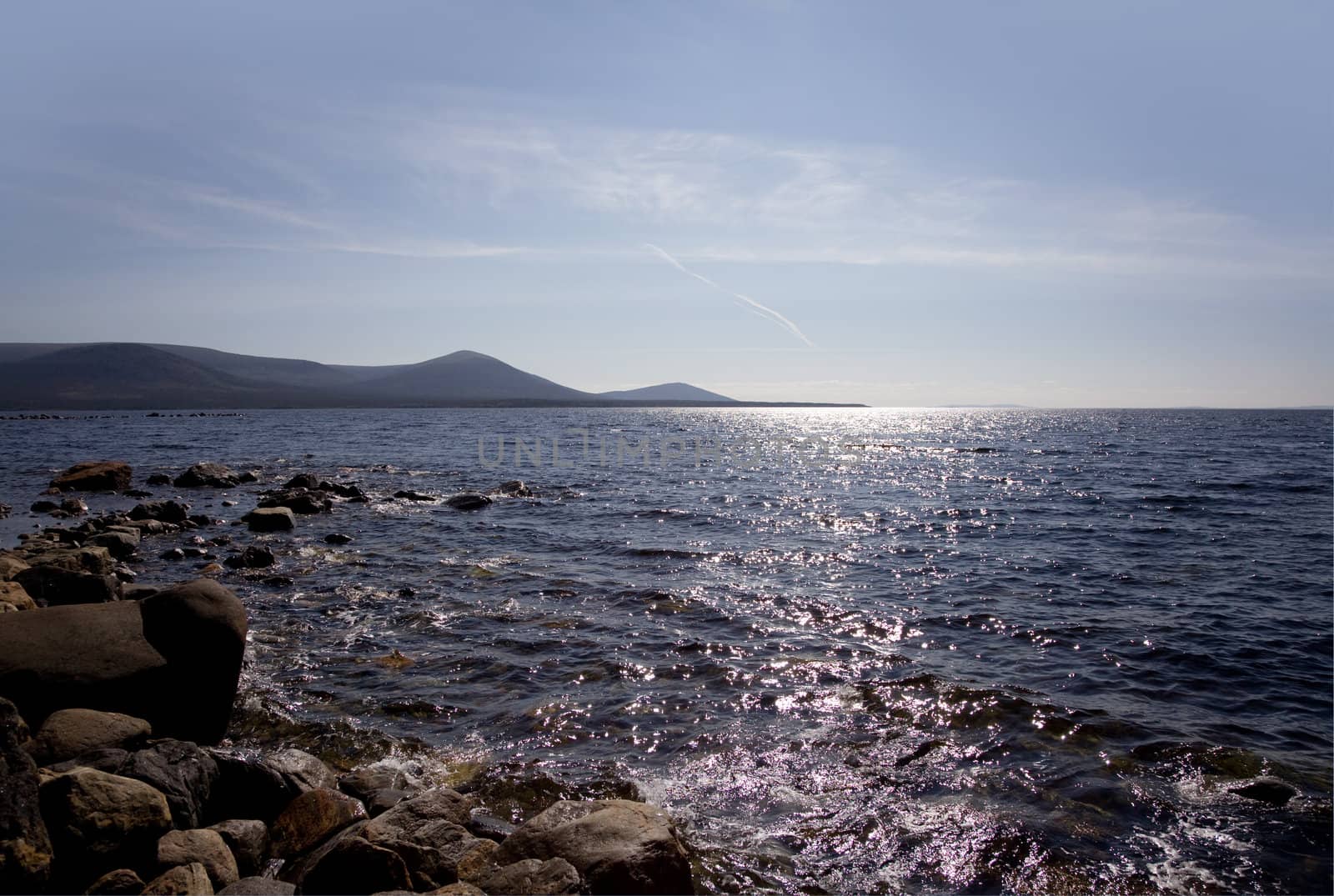 Seascape with a view of the islands and mountains. Russia. Kola Peninsula. Kandalaksha