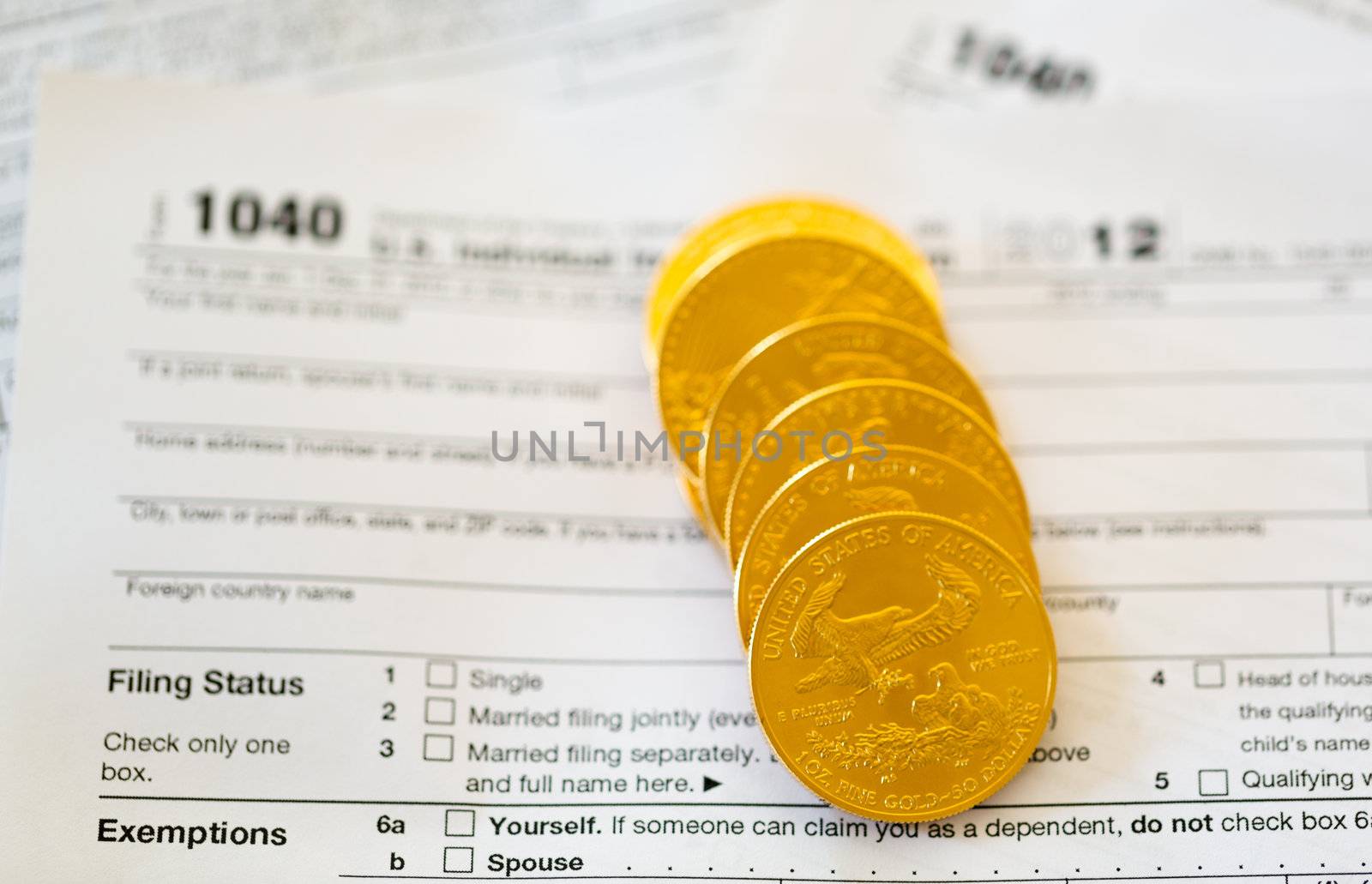 Tax form 1040 for tax year 2012 for US individual tax return with gold coins