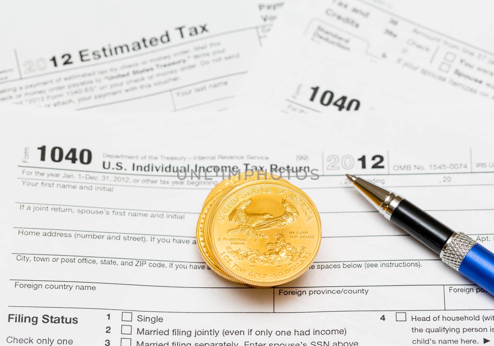 Tax form 1040 for tax year 2012 for US individual tax return with gold coins