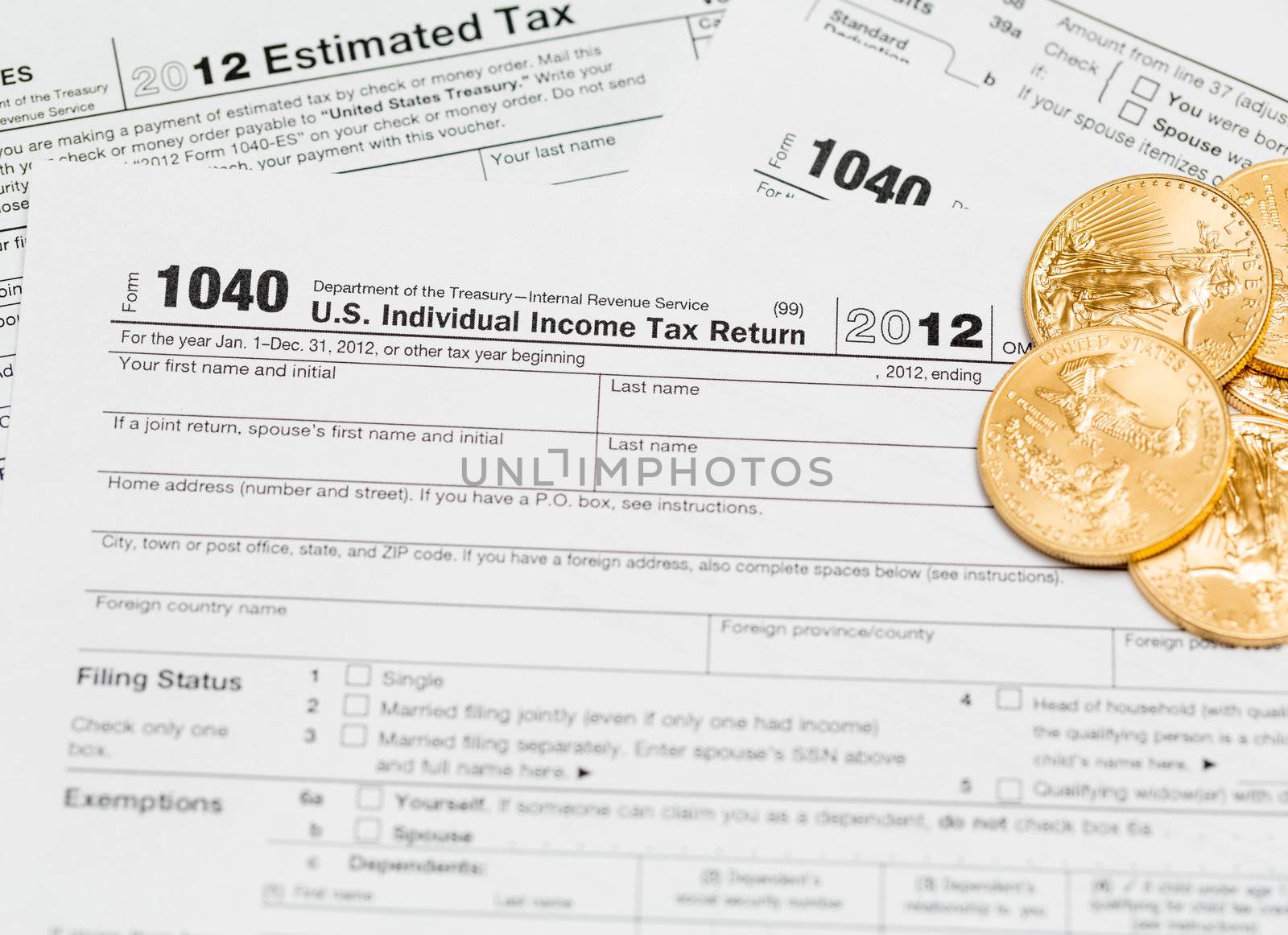 Tax form 1040 for tax year 2012 for US individual tax return with gold coins
