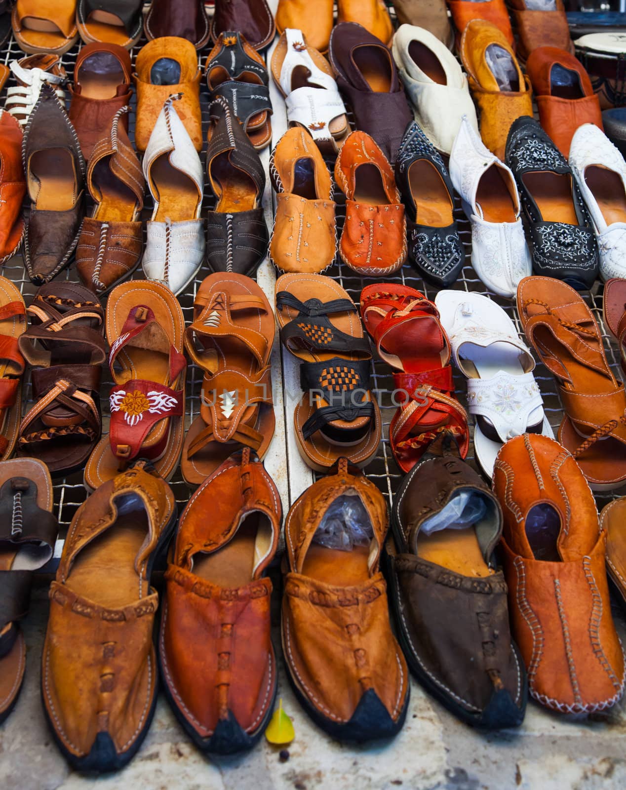 Shoes for sale on a tunisian street  by fambros