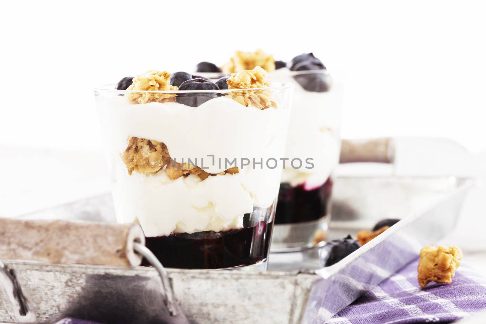 blueberry yoghurt dessert in front of other on a metal tray