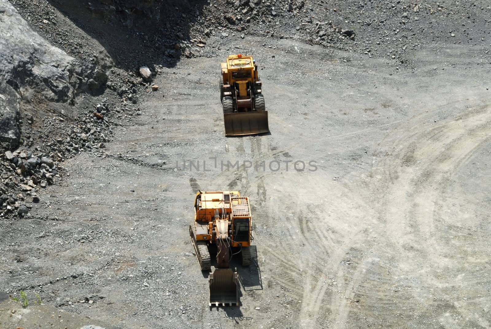 Old coal mine with machines gathering the resources