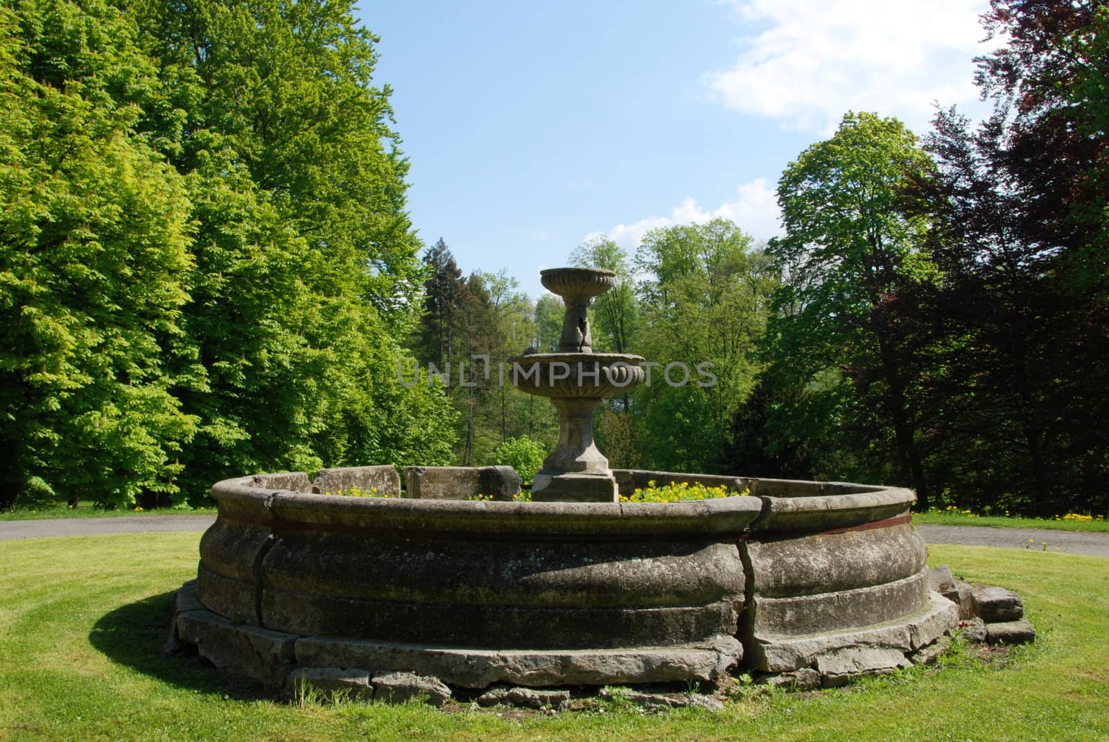 Ould stone water fountain in the Park