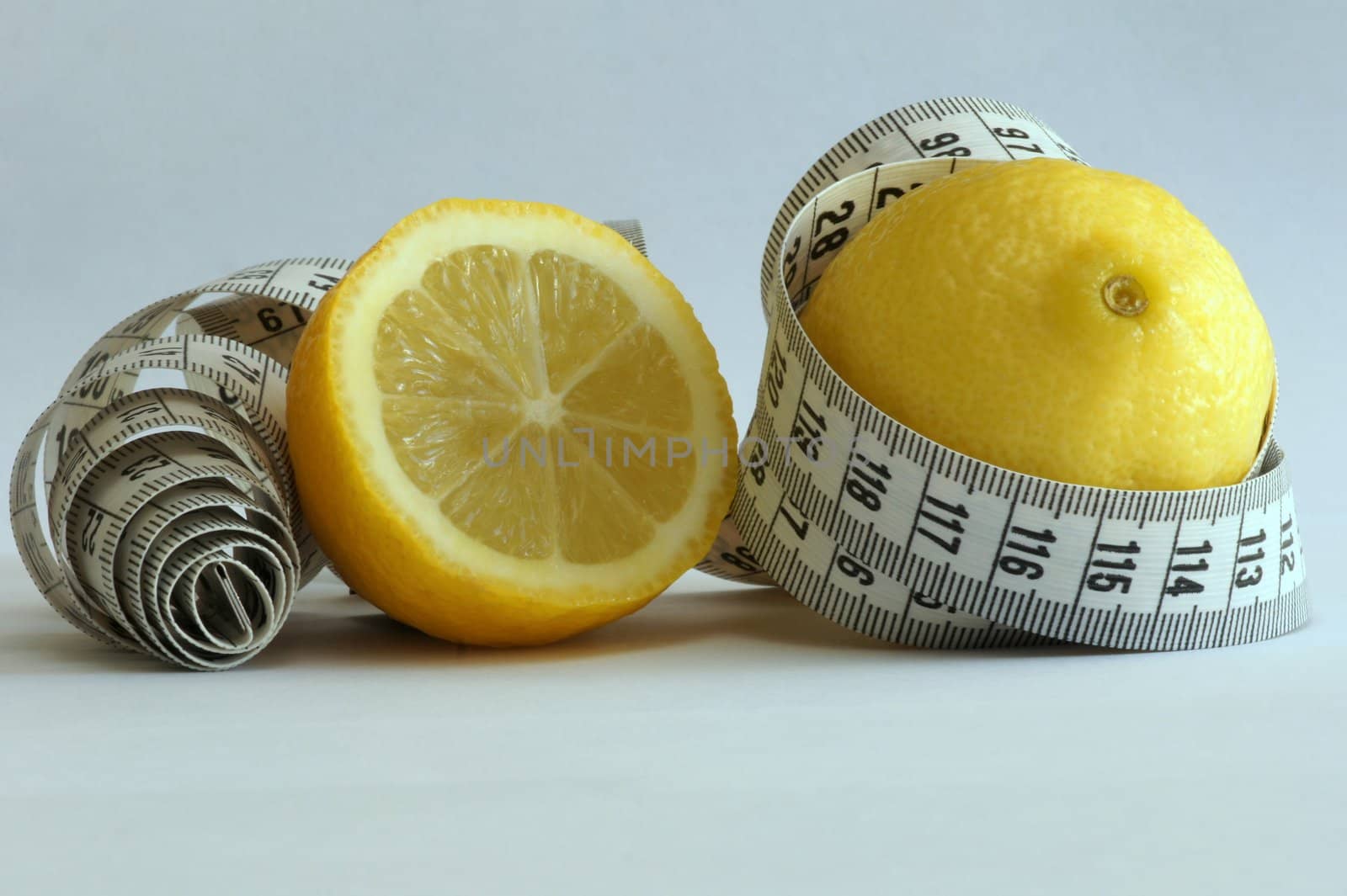 Close-up of a lemon with a measuring tape around it