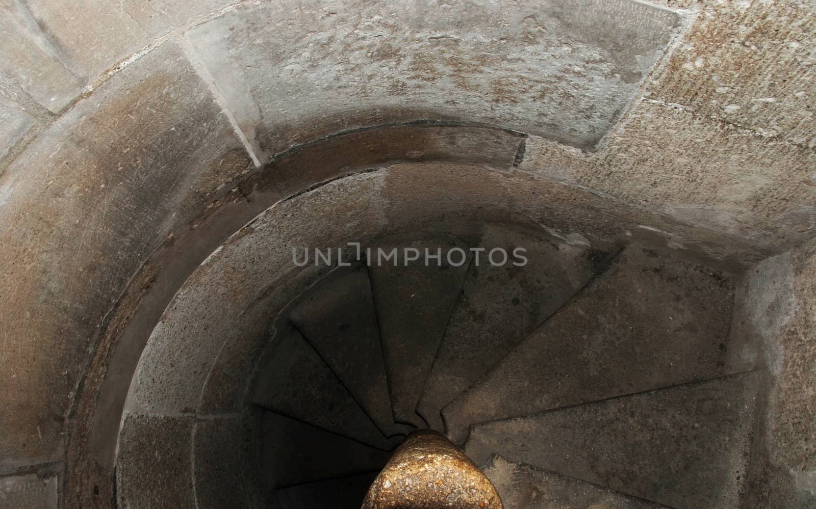 Ancient stairway in abandoned ruined castle tower leading to catacoms