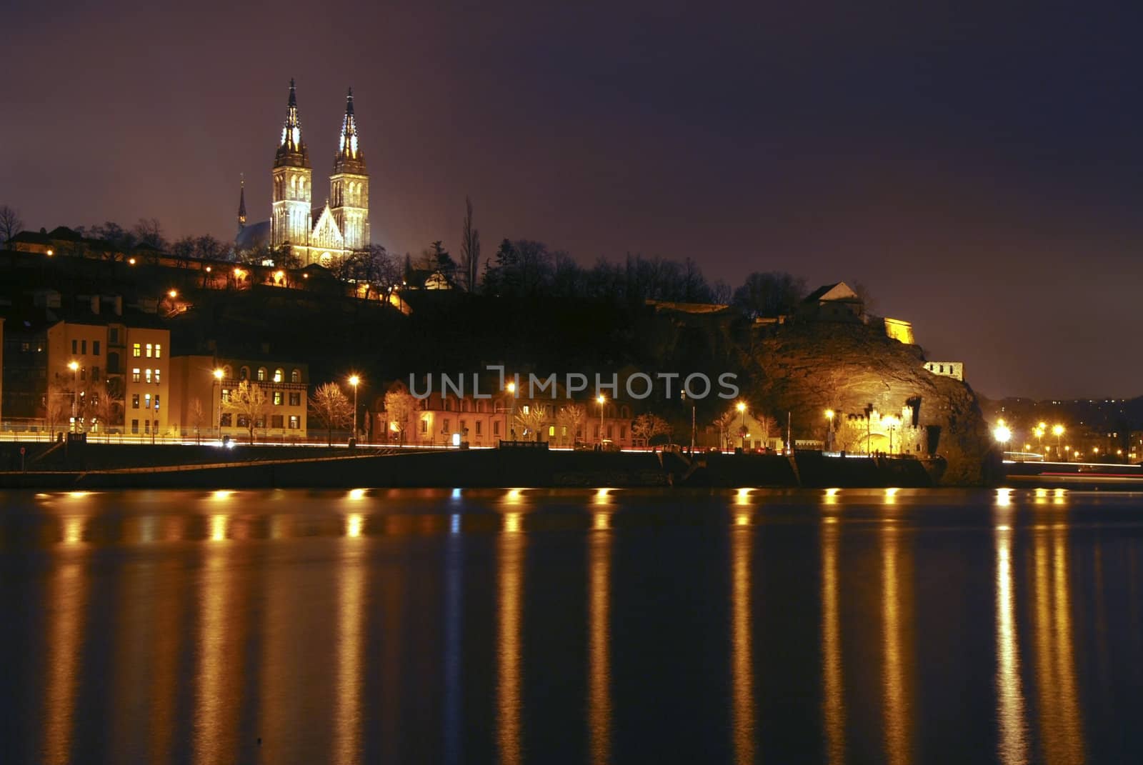 Vysehrad Church in Prague seen from the distant bank of river Vltava
